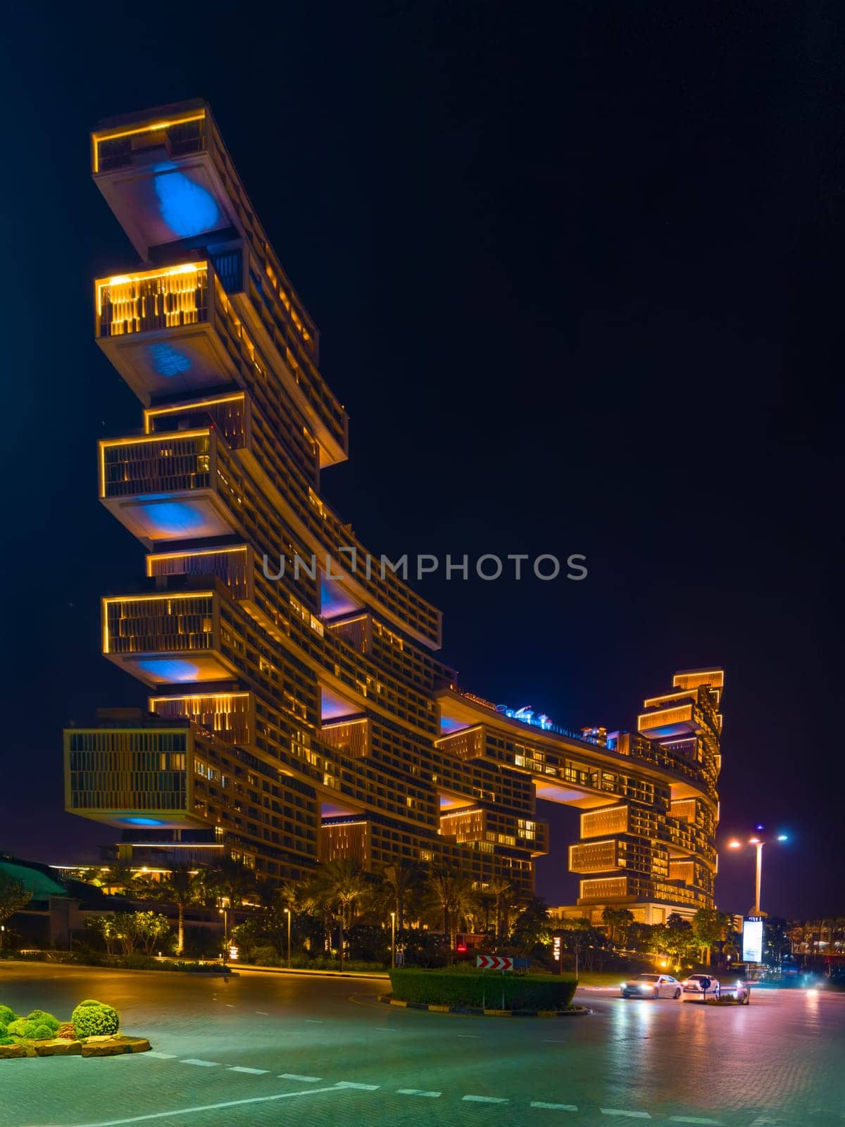 UAE, Dubai, 25 October 2024: The luxury hotel Atlantis the Royal at night, architecture of the city at night, skyscrapers with glass facades. High quality photo