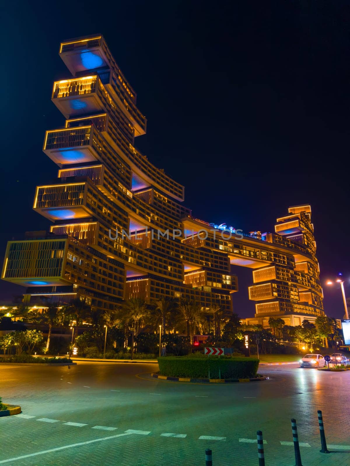 UAE, Dubai, 25 October 2024: The luxury hotel Atlantis the Royal at night, architecture of the city at night, skyscrapers with glass facades. High quality photo