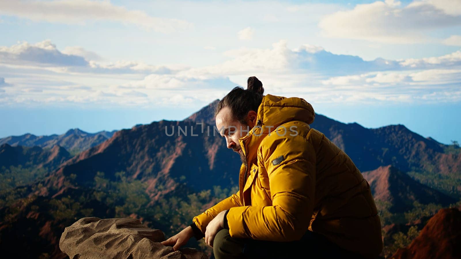 Clumsy mountain hiker dropping his phone due to lack of attention, unequipped traveler defocusing and being reckless. Modern person in the nature obsessed with technology. Camera A.
