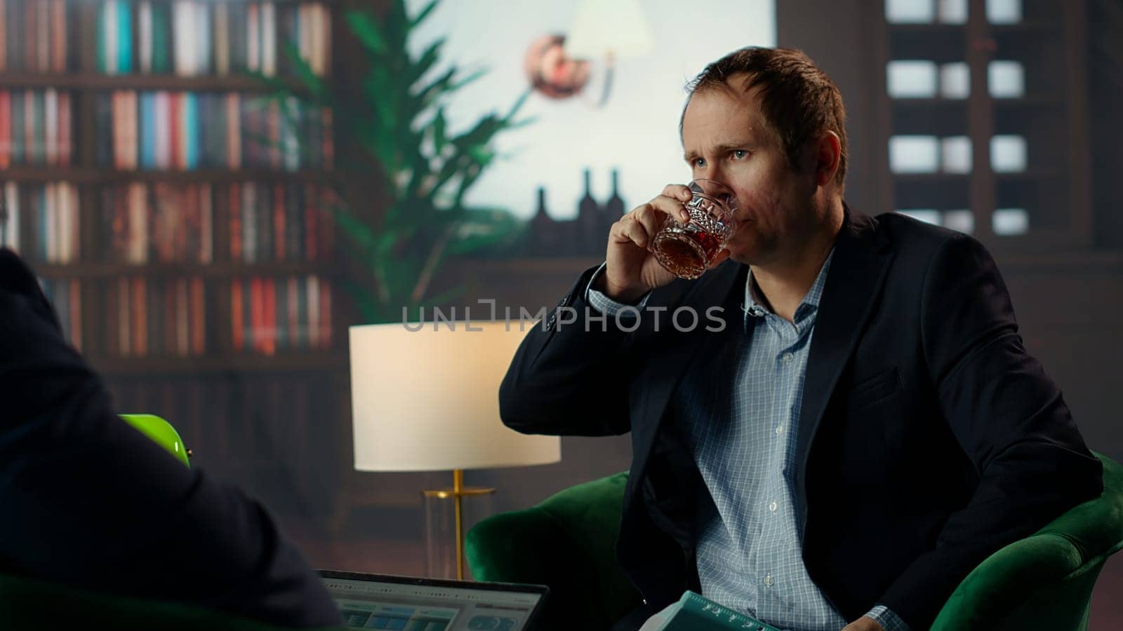 Diverse secret service duo in a CIA library lounge reviewing strategic information, making decisions for national safety governmental agency. Monitoring documents for case evidence. Camera B.