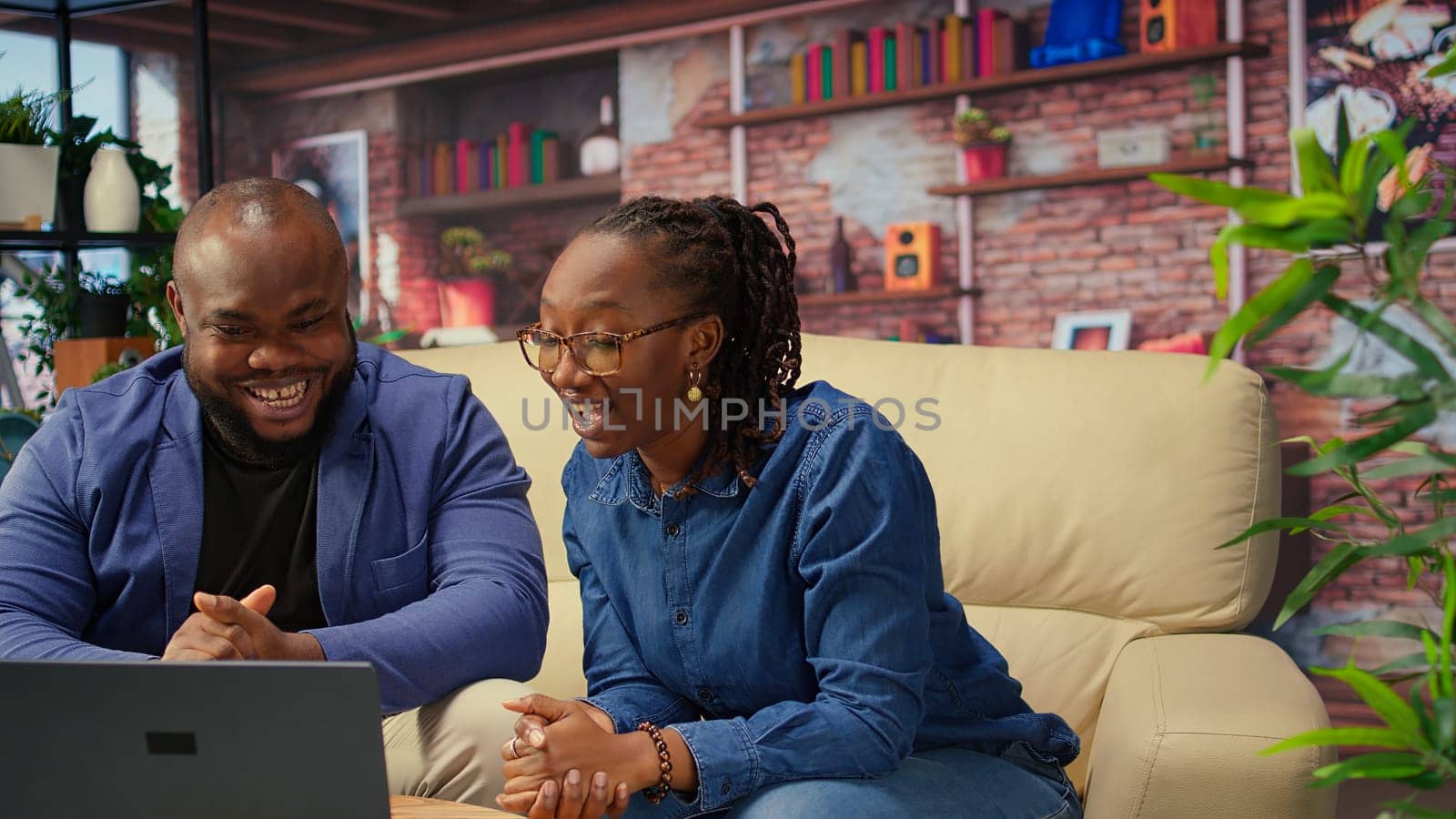 African ameircan people meeting with colleagues remotely on video call, discussing about tasks details and meeting on teleconference for a briefing. Man and woman chatting on web. Camera A.