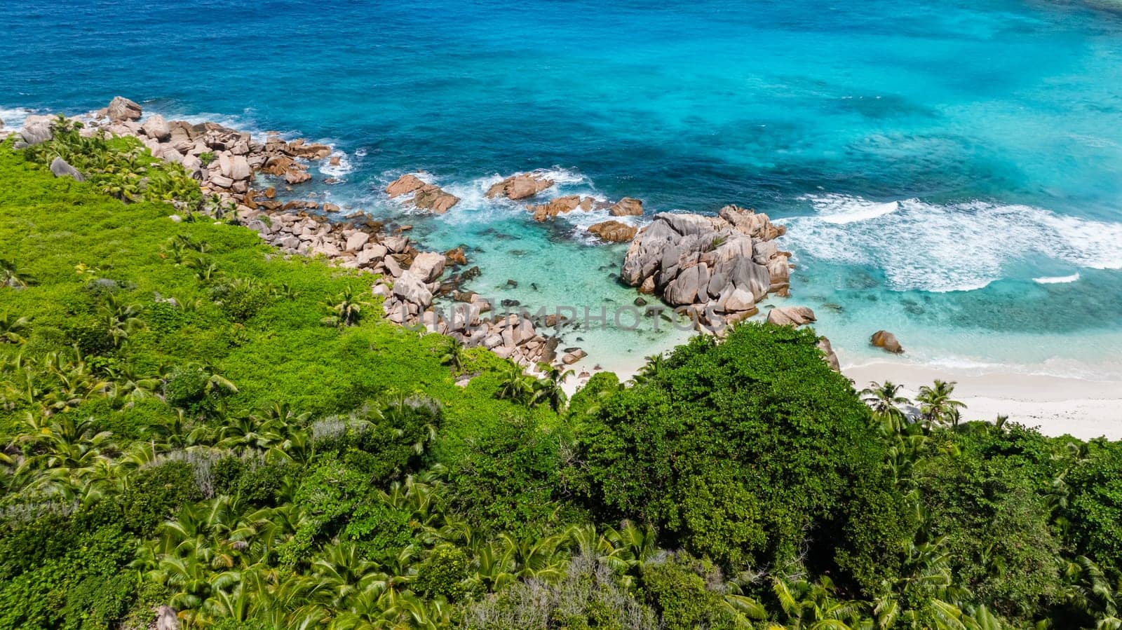 Tropical sandy beach and blue sea. Anse Cocos. Seychelles, La Digue.