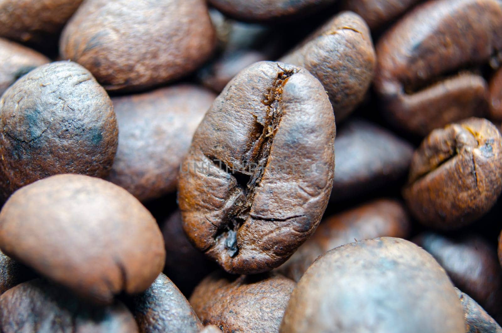 Straight view of roasted coffee beans with customizable space for text.