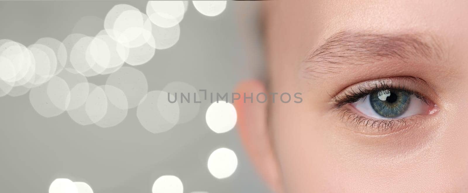 A close-up view of a person's eye showcases intricate details such as the vibrant iris and delicate eyelashes.