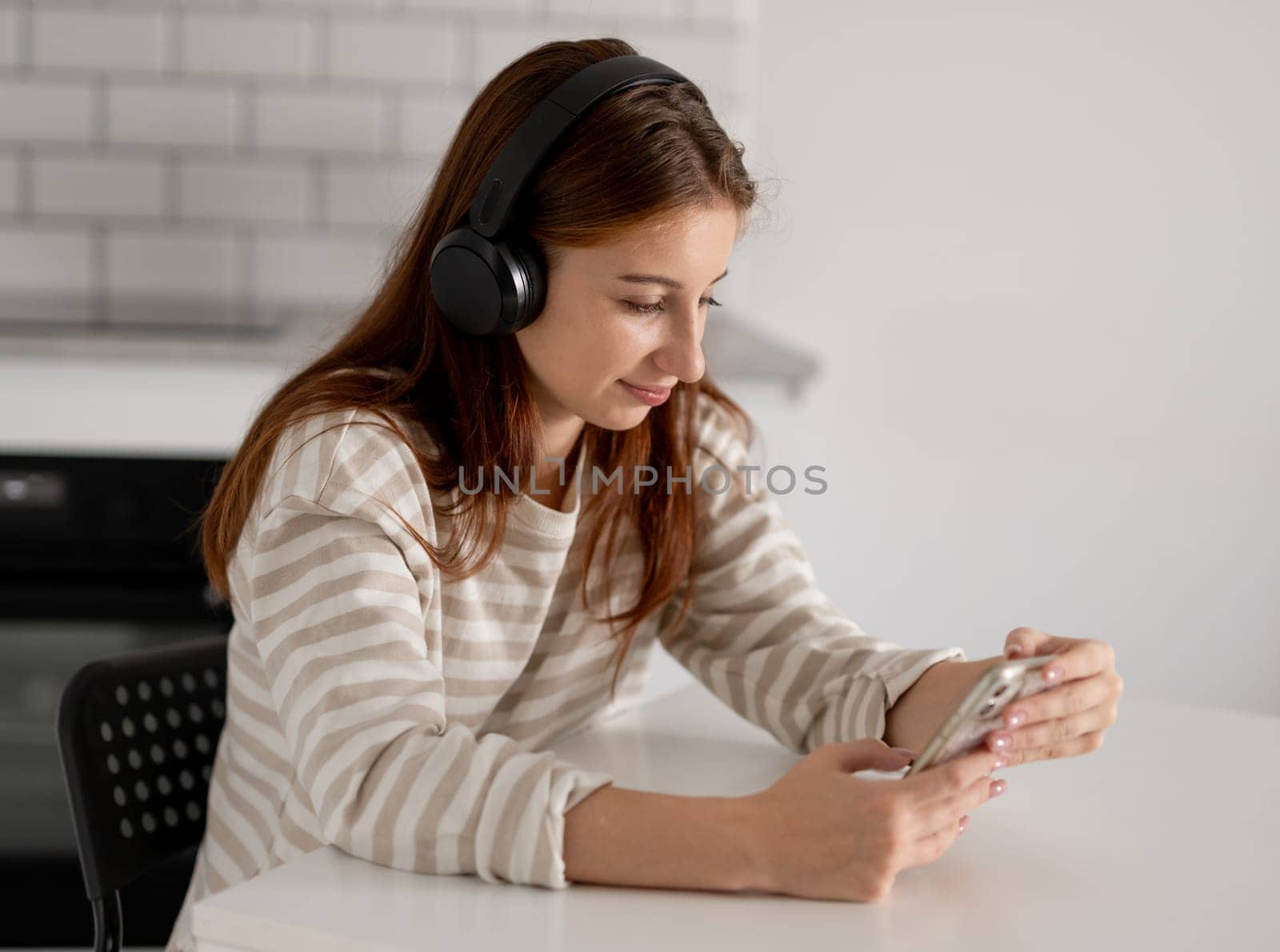 Happy Teen Girl Using Smartphone With Headphones