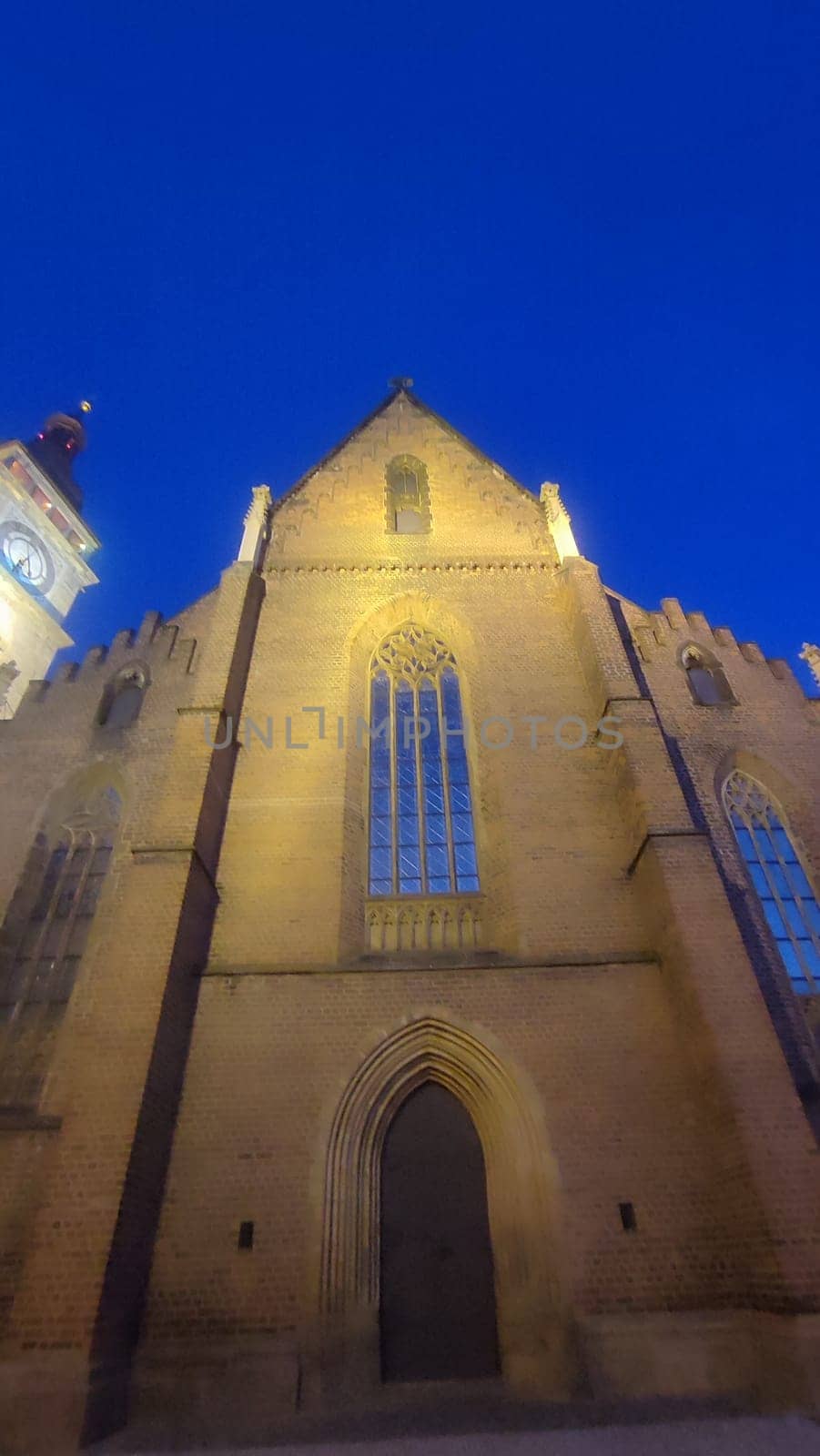 October 22 2024 Hradec Kralove Czech Republic Europe Kralov region, Kralovehradecky kraj. Church illuminated dusk historical objects building architecture street night light . High quality photo
