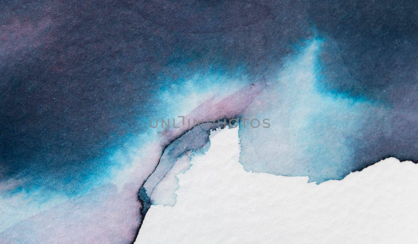 Soft shades of blue and violet merge seamlessly, creating an abstract display on textured paper. The artwork captures the fluidity and depth of watercolor, inviting contemplation and calm.
