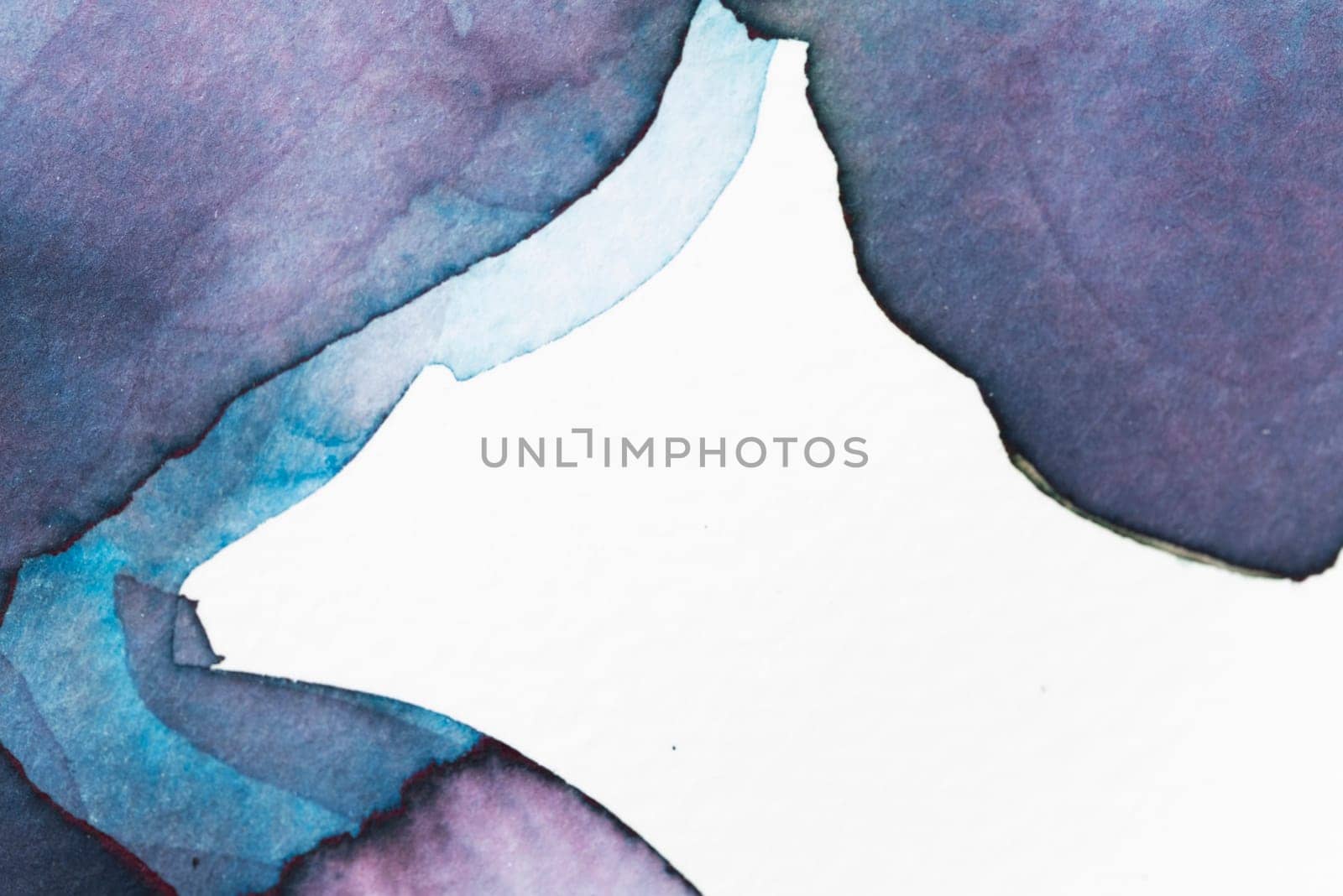 Swirls of blue and violet watercolor create an abstract composition on textured paper, emphasizing fluid shapes and vibrant colors.