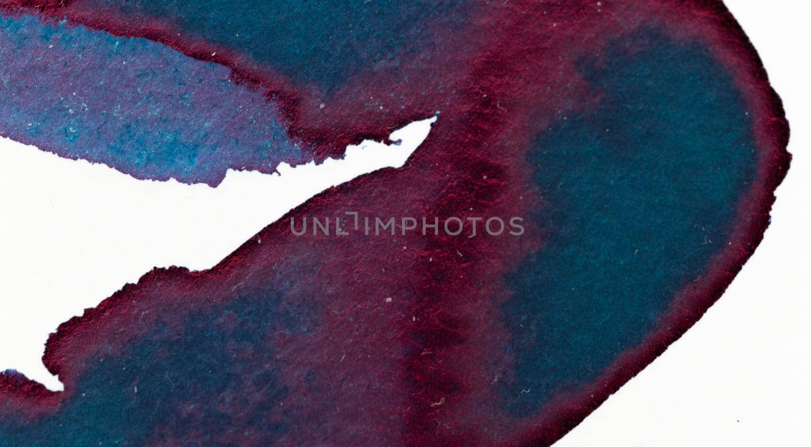 A vibrant blend of deep blue and burgundy watercolor creates an organic pattern on textured paper. The smooth flow of colors captures the essence of creative expression in a tranquil setting.