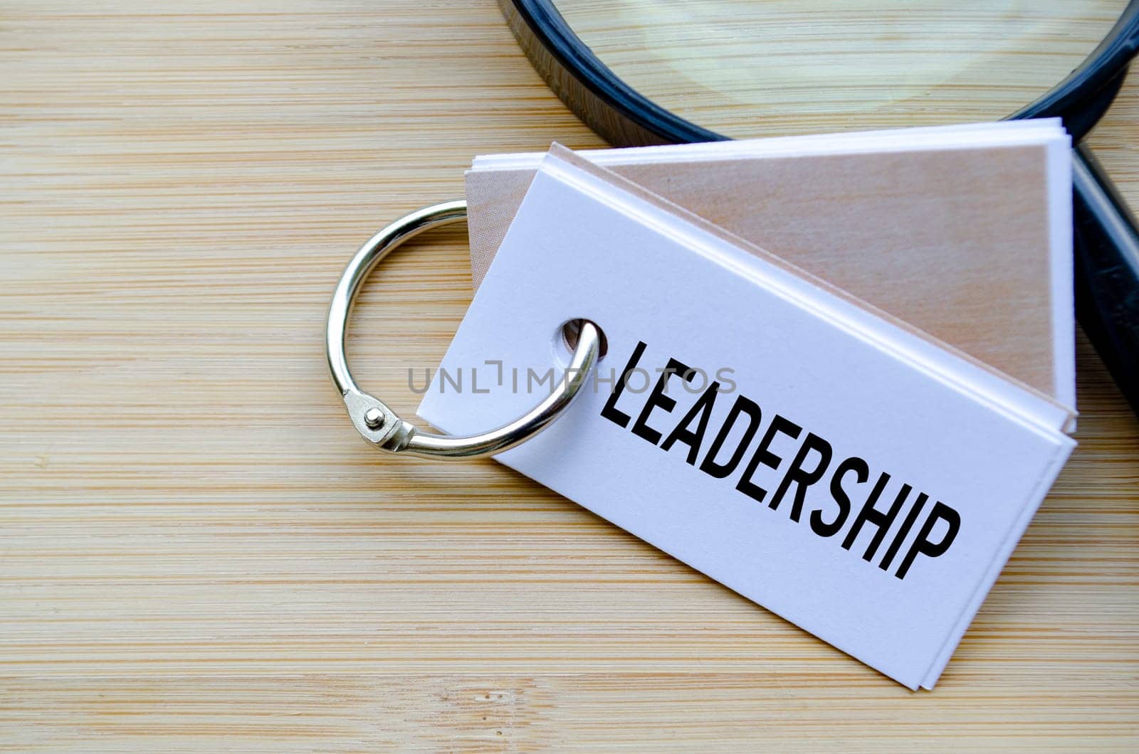 Leadership text on notepad highlighting the core of organizational direction and influence.