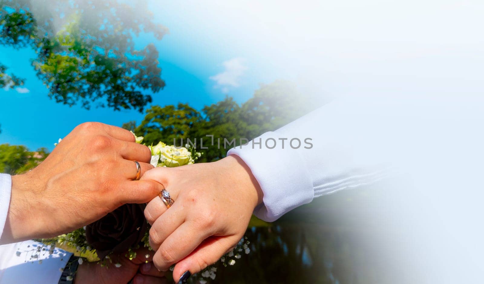 men holding woman hand with golden wedding ring with diamond. Wedding ring before the proposal. Luxury wedding rings. newlyweds holding hands showing rings