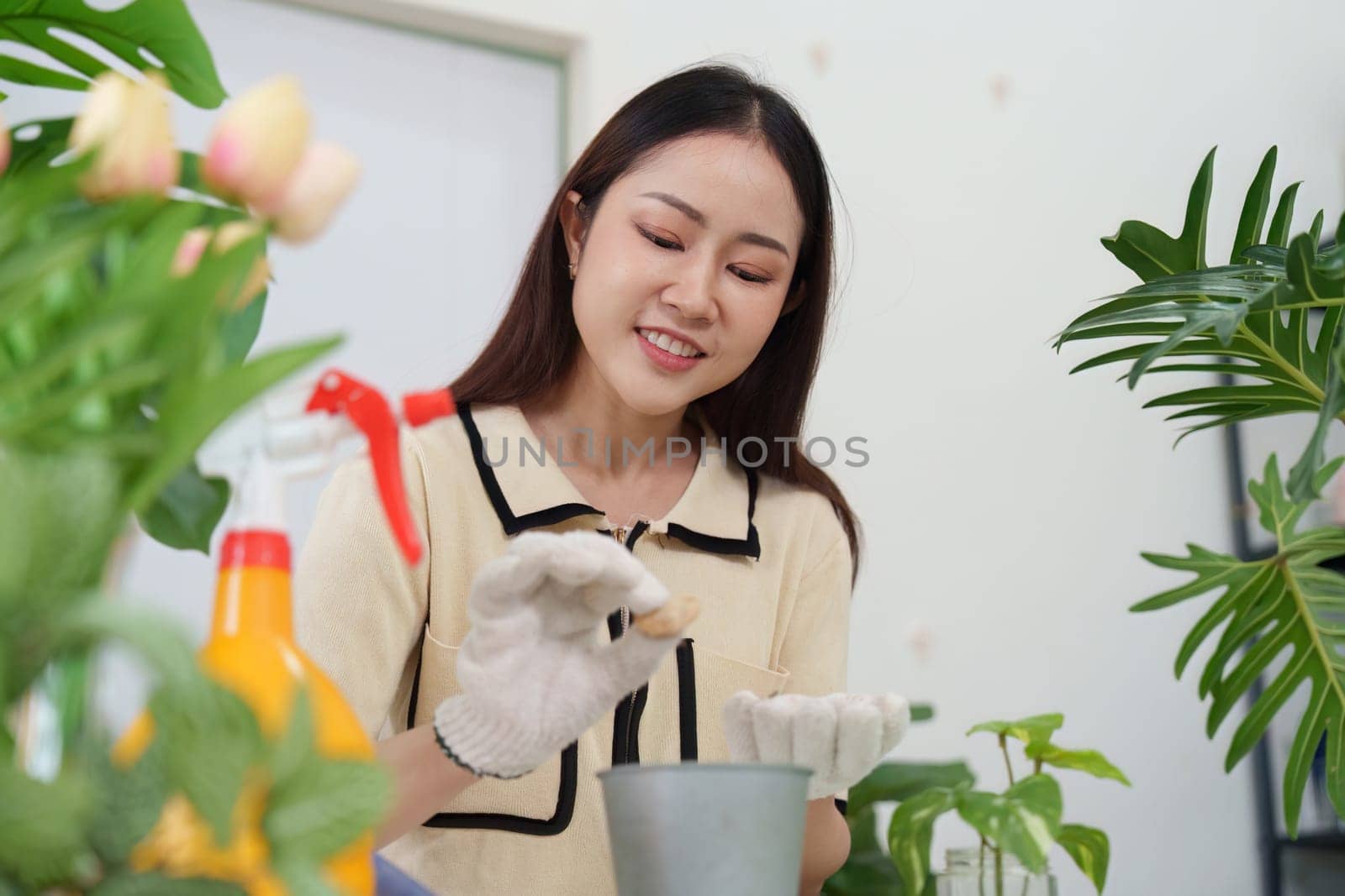 A cheerful gardener preparing to plant seeds in a pot, demonstrating enthusiasm and dedication to her gardening hobby in a vibrant setting.
