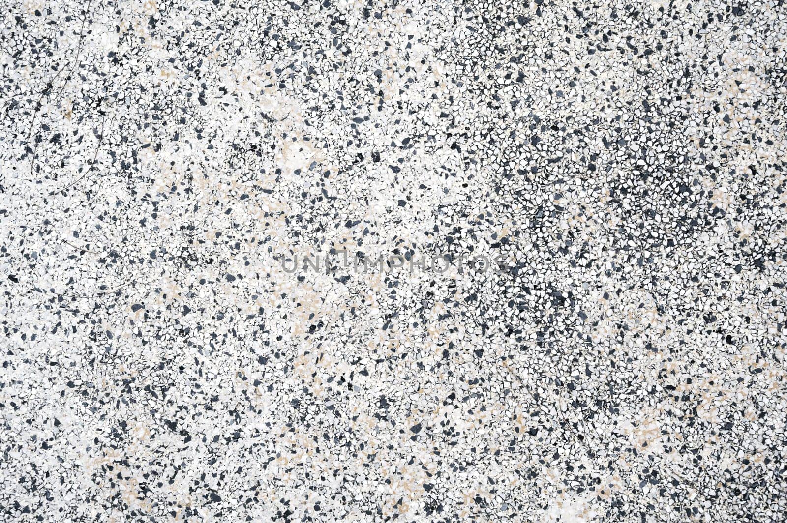 background with a rough sidewalk texture with natural pebbles. Surface of decorative pavement