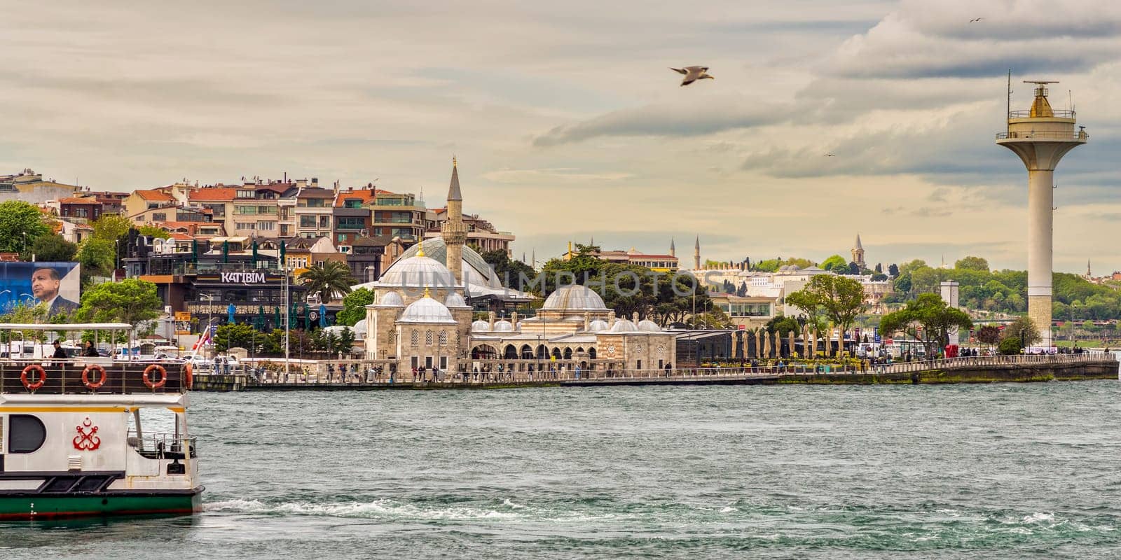 Istanbul, Turkey - May 10 2023: Semsi Pasha Mosque, an Ottoman mosque situated in the Uskudar district on the Asian side of the Bosphorus Strait, with Rum Mehmed Pasha Mosque in the distant background