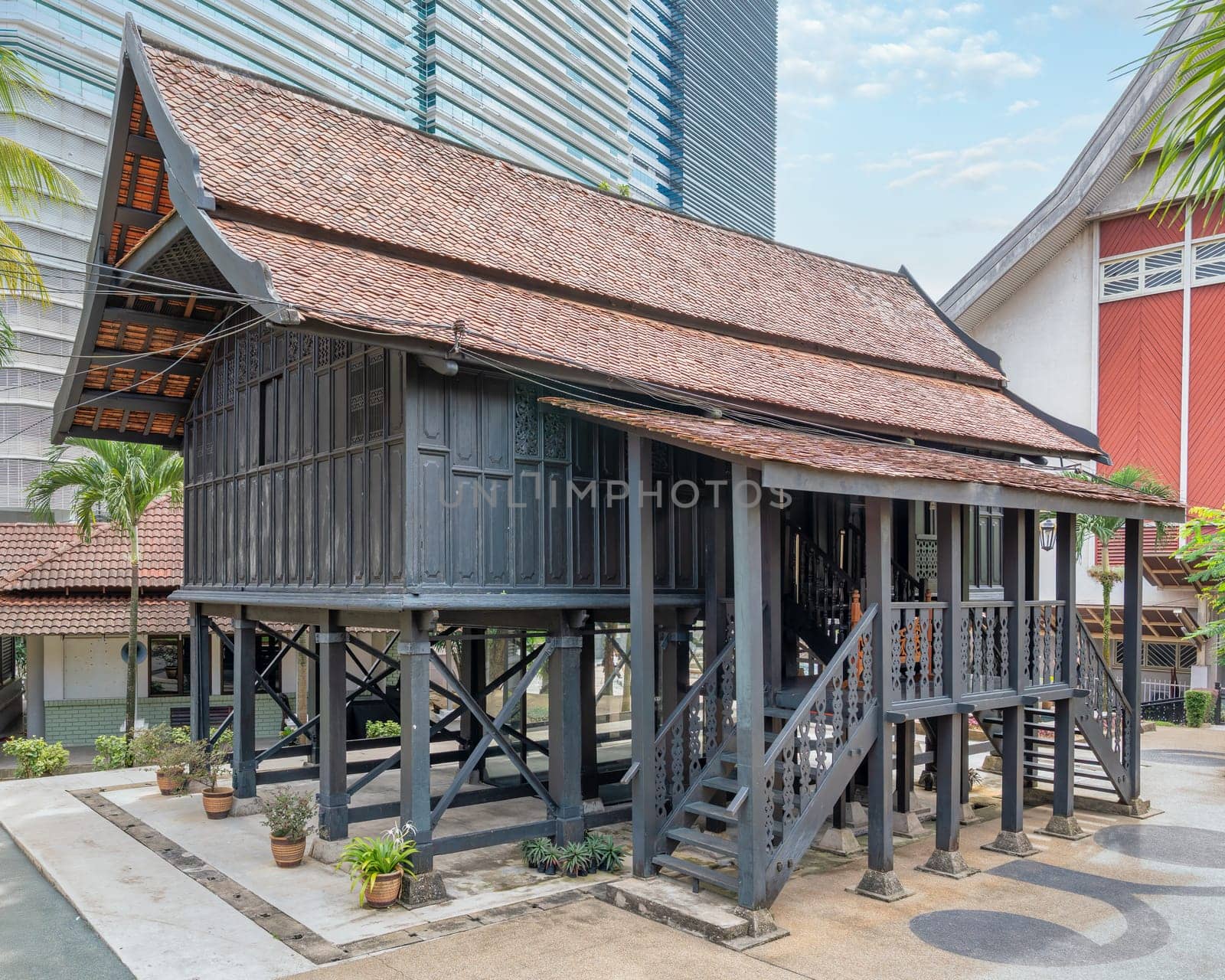 Part of Istana Satu, historic palace in Kuala Terengganu, showcases traditional craftsmanship with intricate carvings and robust chengal wood construction, reconstructed in Muzium Negara in April 1974
