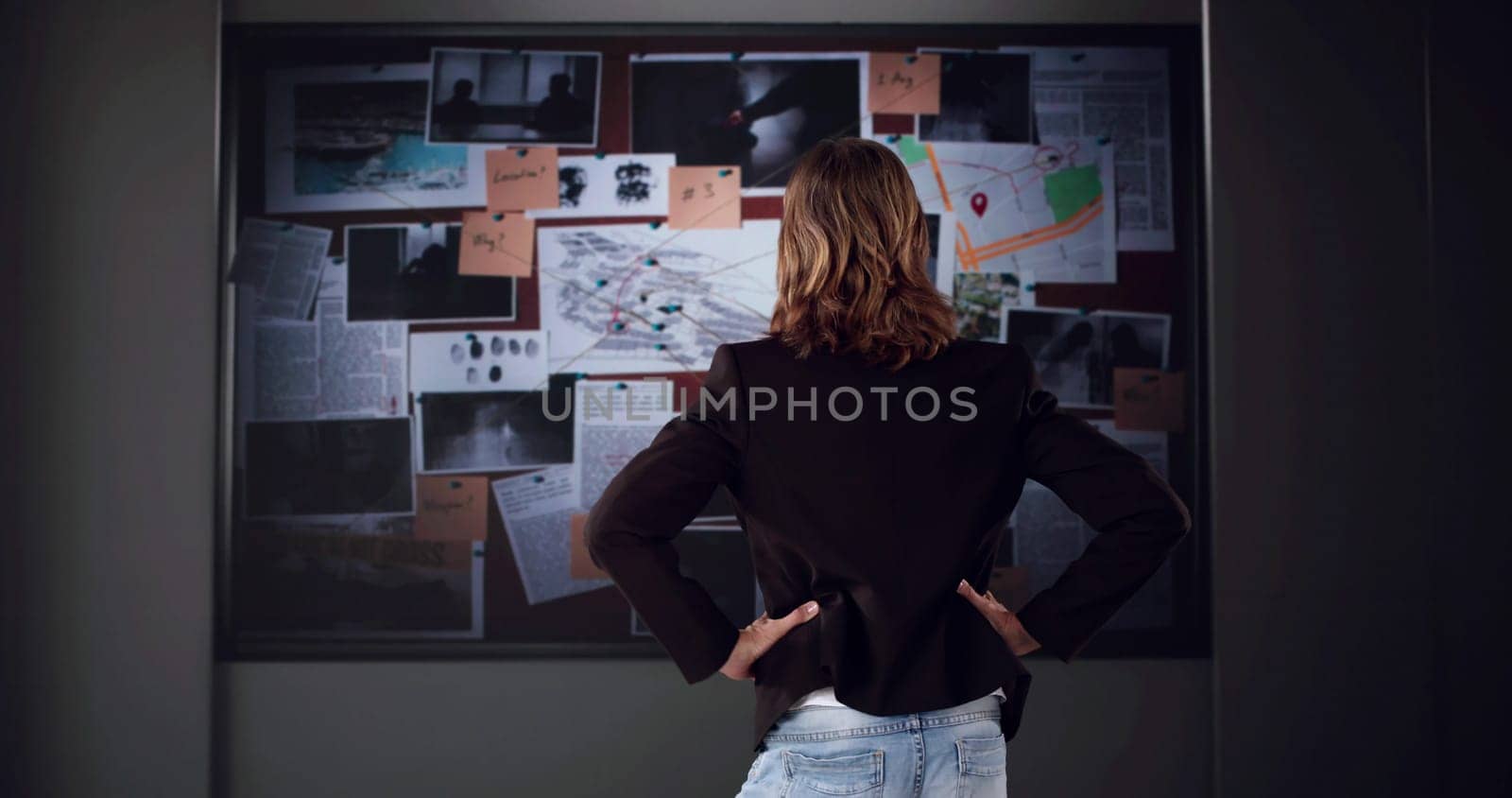 The Private Detective Examining Evidence In Crime Investigation Office