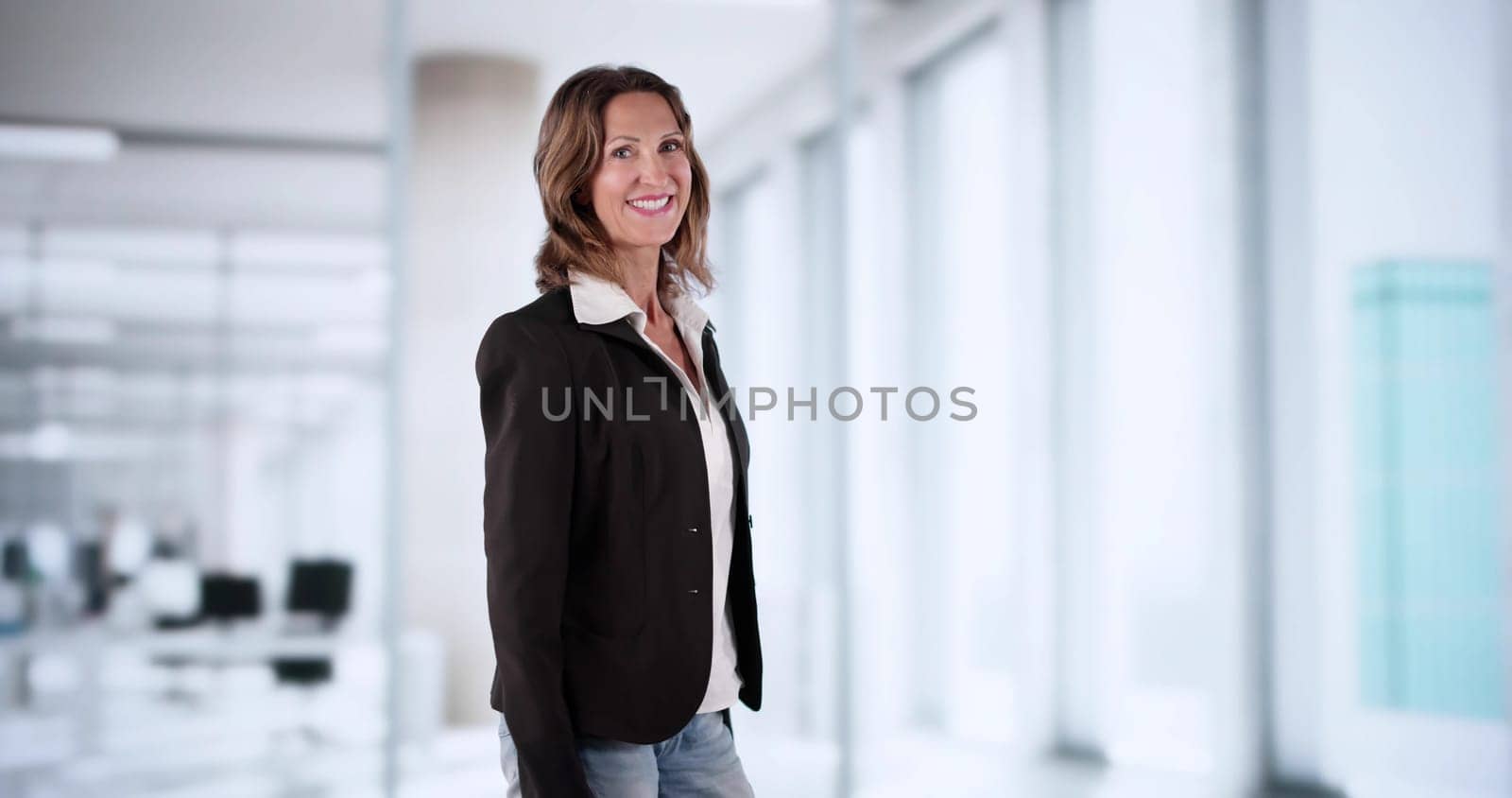 Confident Businesswoman And Happy Coach Standing In Professional Corporate Workplace.