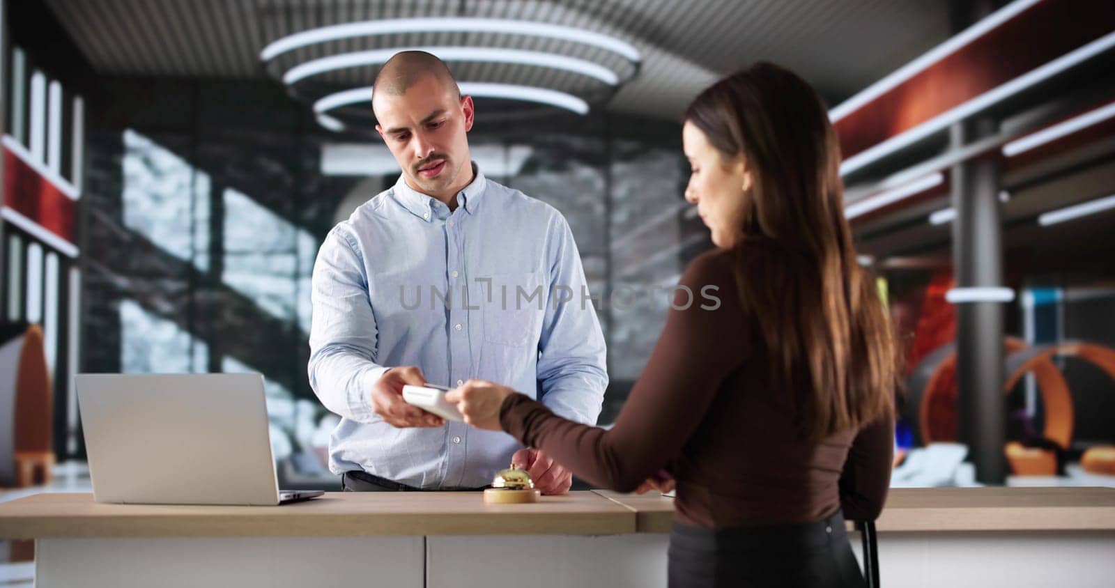 Busy Hotel Concierge Manages Guests With Professionalism And Courtesy