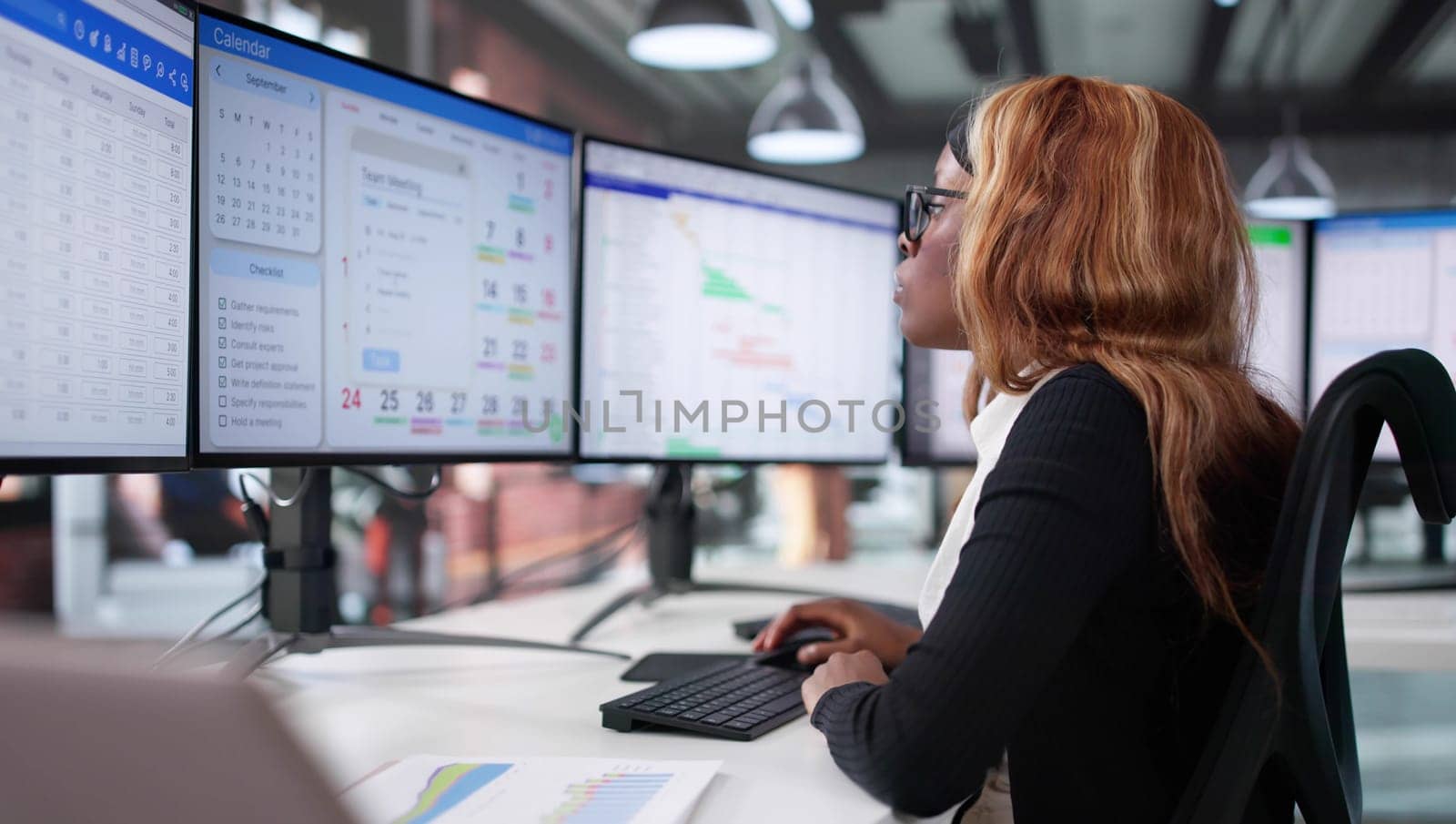 Businesswoman Utilizing Agile Project Management Software On Desktop Computer Screen