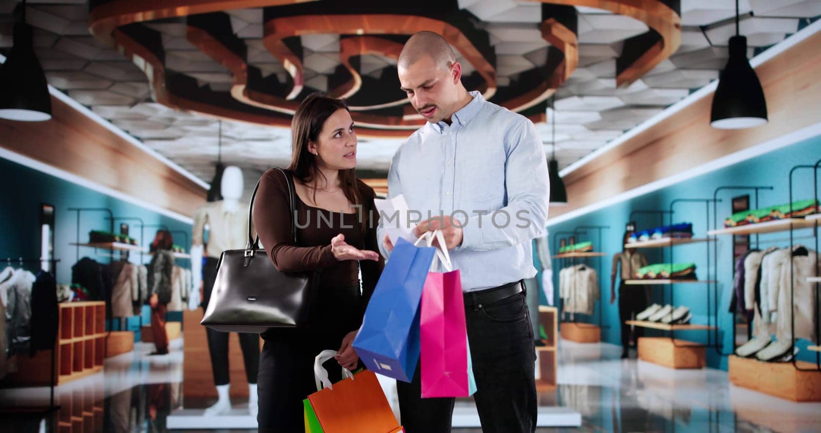 Confused Woman Checks Her Receipt At Supermarket In Shopping Mall.