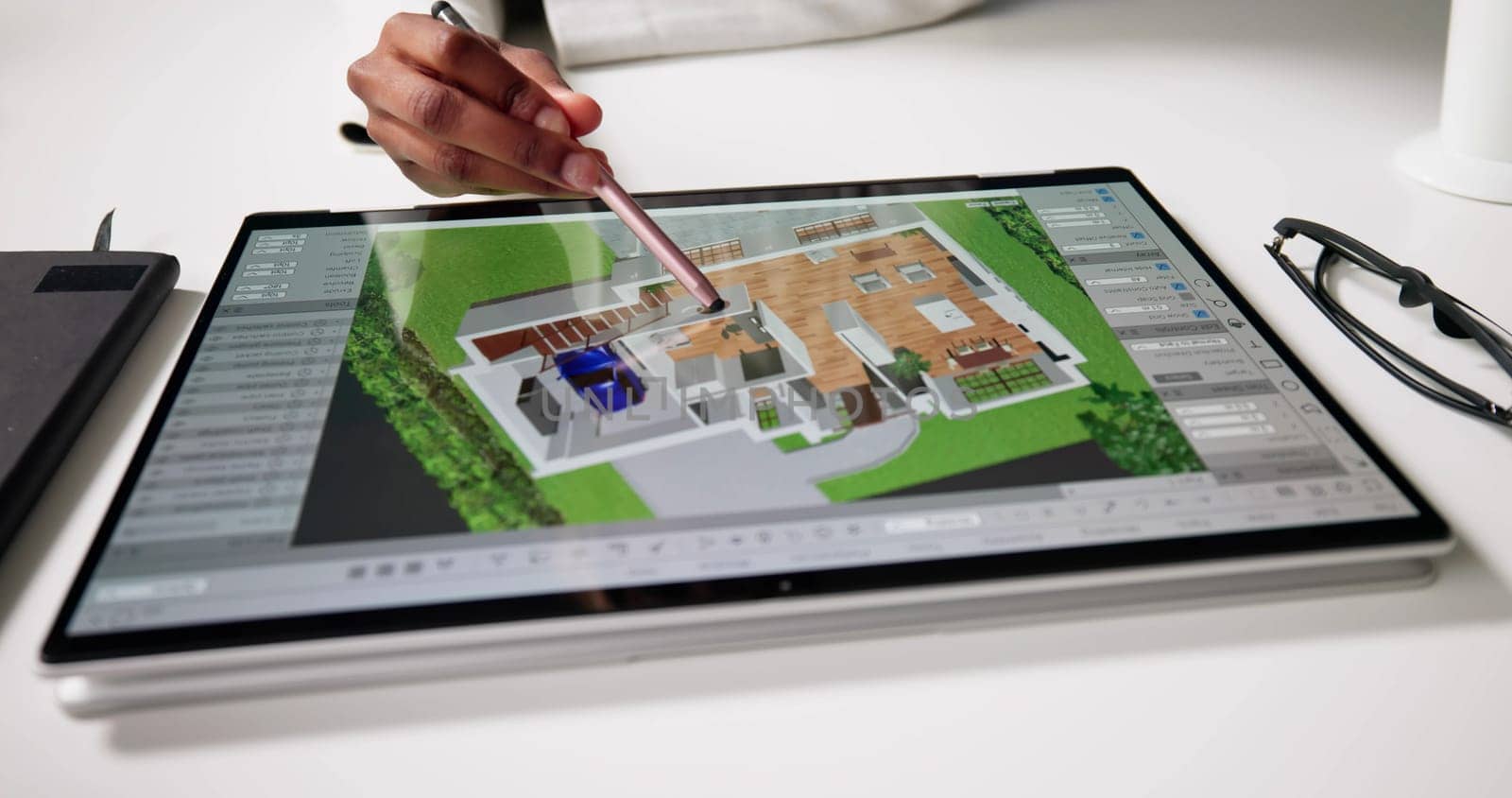 Female Real Estate Agent Design House Plan On Tablet Computer.