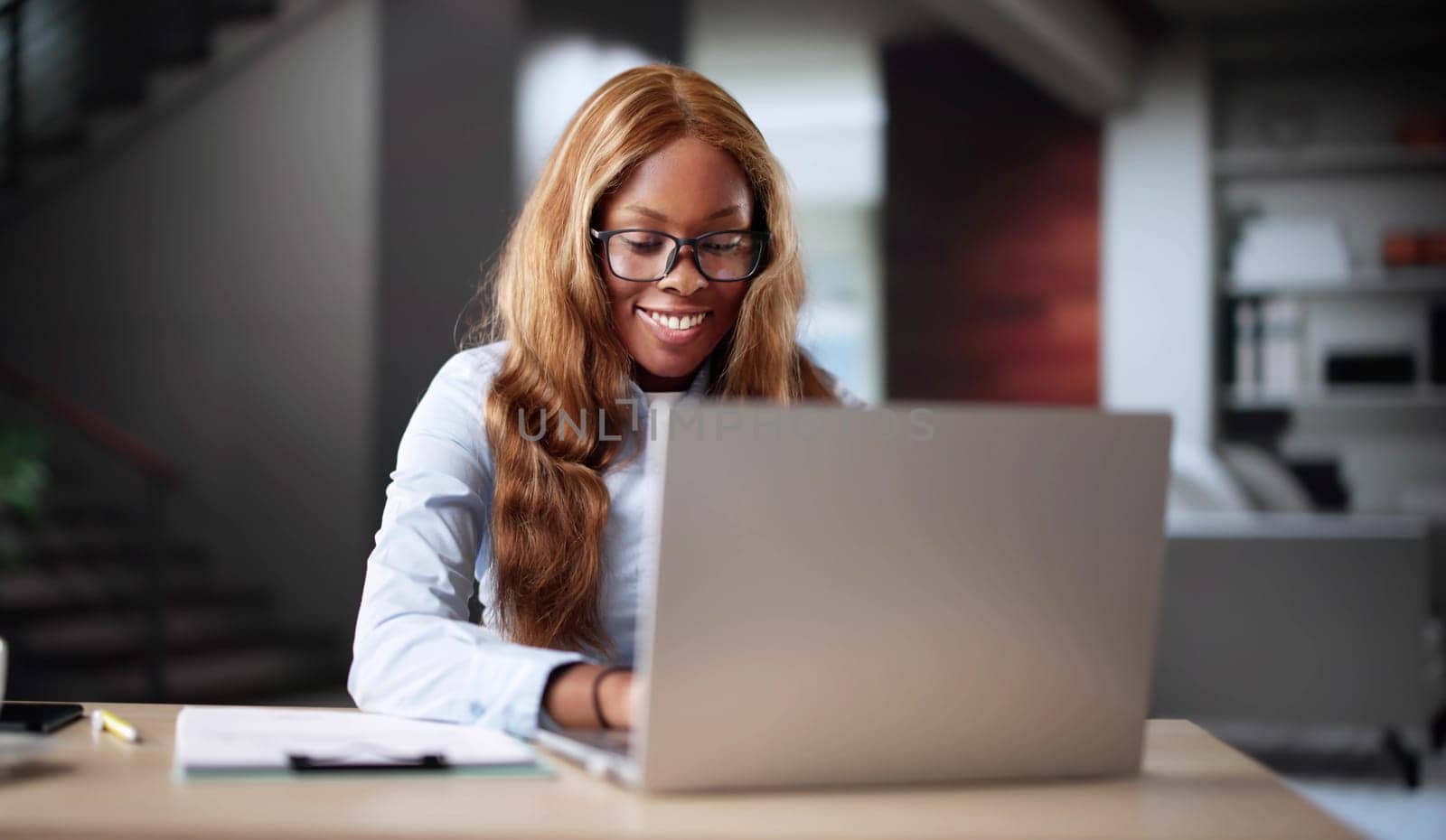 Young Black Woman Studying Tax Bills Online With Laptop Computer.