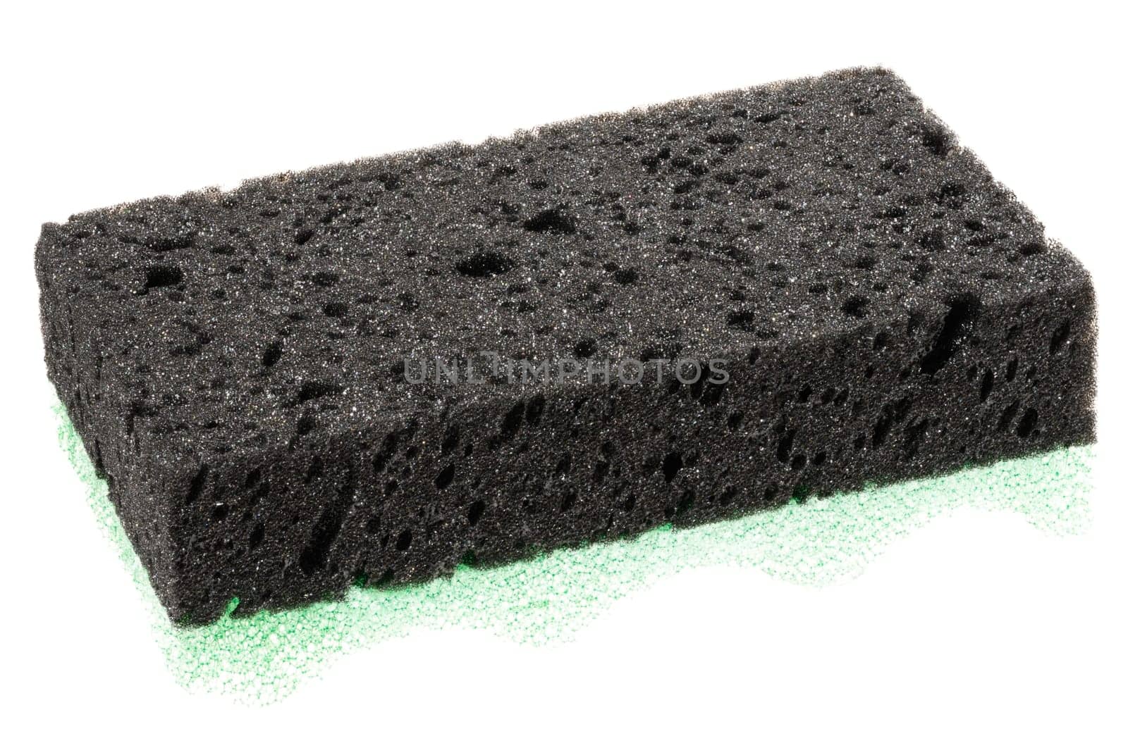 Rectangular piece of black porous sponge. Close-up on isolated background