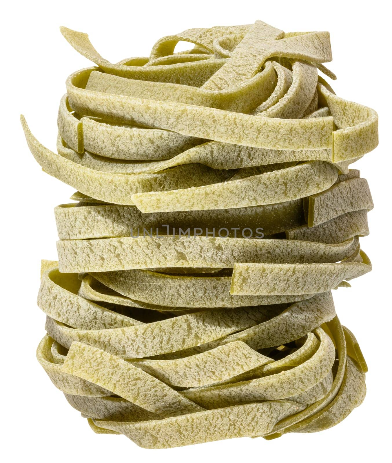 Nest of dry green egg pasta tagliatelle with spinach, isolated background. Pile