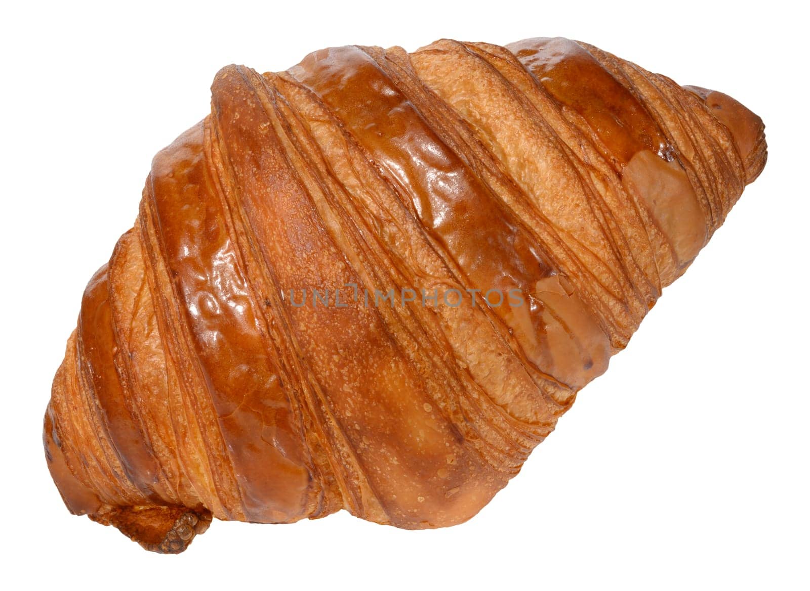 Appetizing, golden brown croissant with a glossy surface. Isolated background