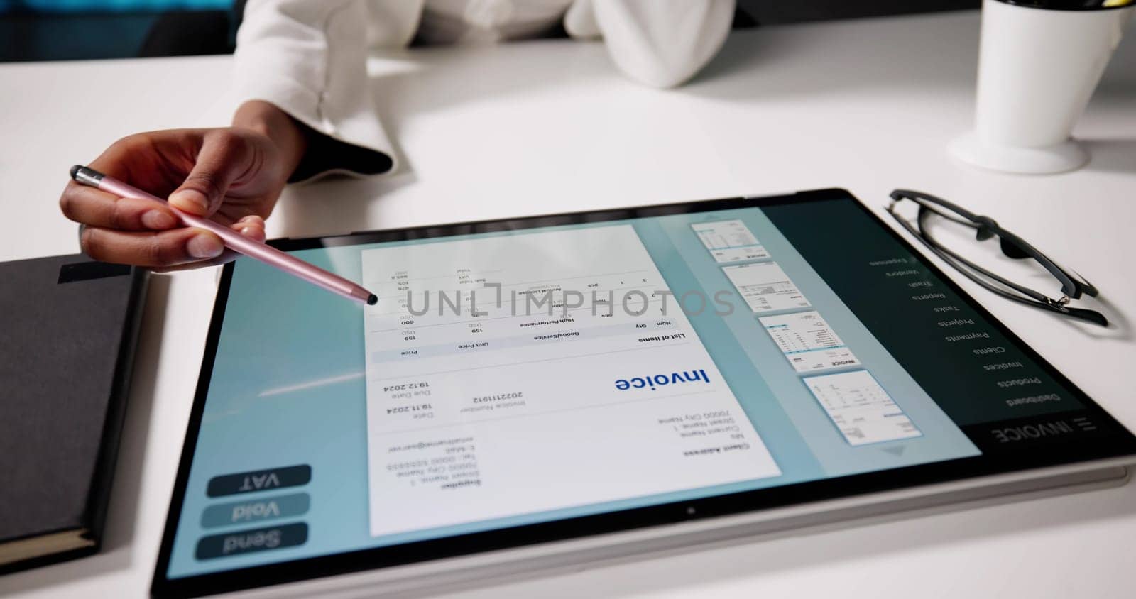 Digital African American Accountant Calculating Invoice Using Hybrid Tablet