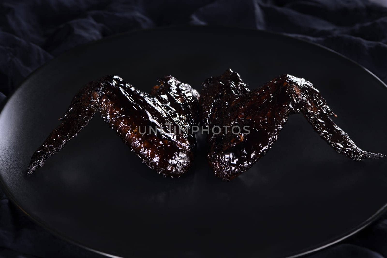  Vampire Wings (Chicken Wings) Cooked in sweet and sour sauce with cuttlefish ink. An original idea for a Halloween party