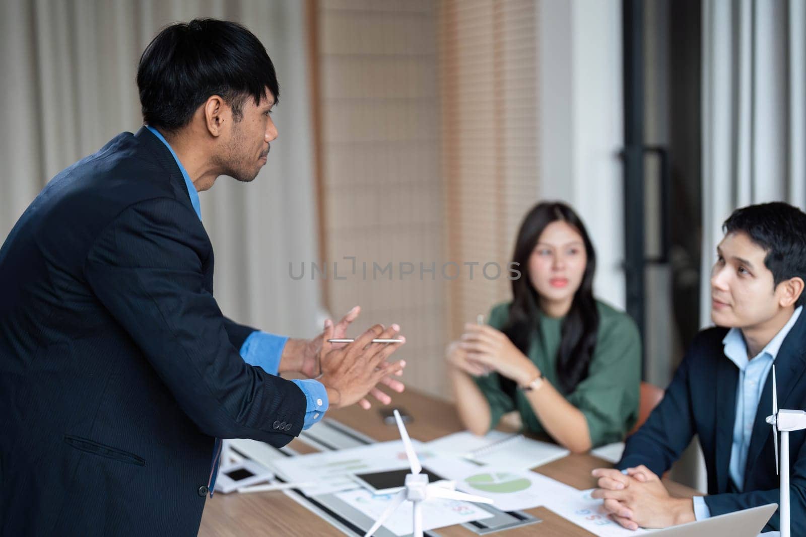 A dynamic meeting where business professionals discuss ESG initiatives, emphasizing sustainability and ethical governance in a corporate environment.