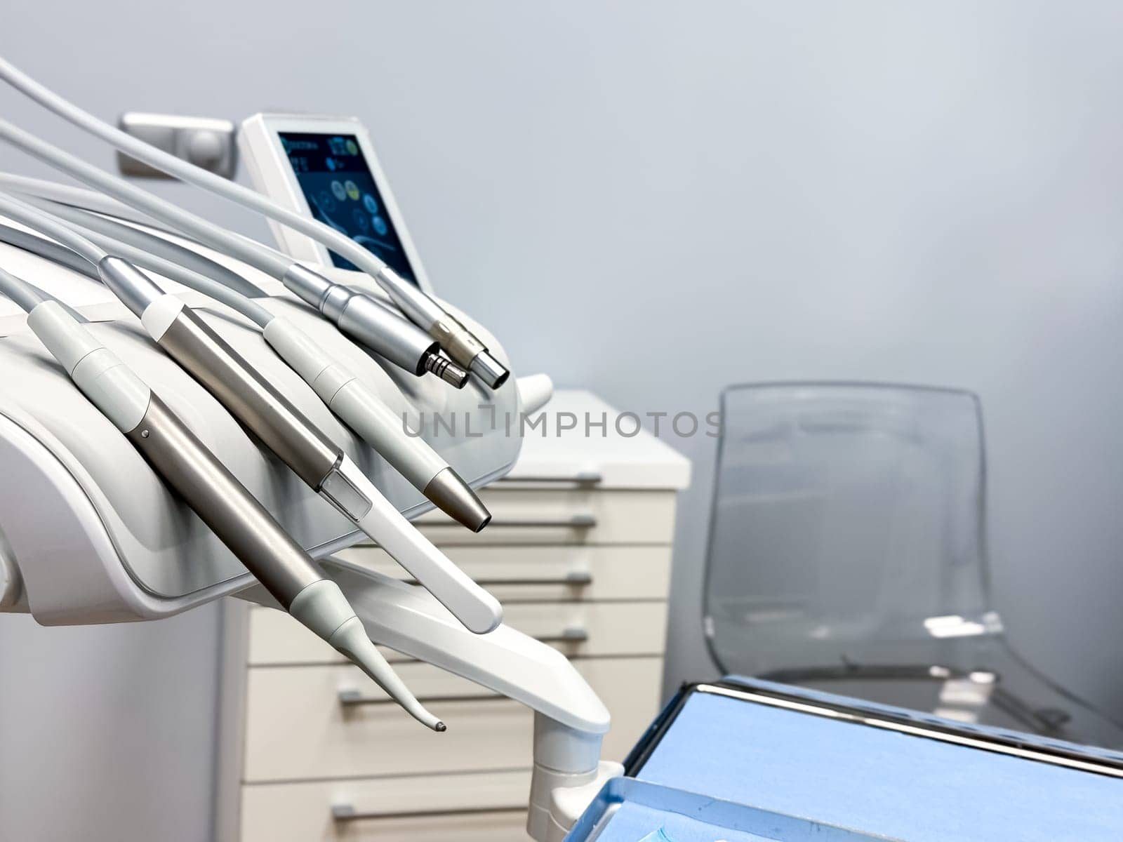 Modern dental tools in a clean and bright clinic setting. High quality.