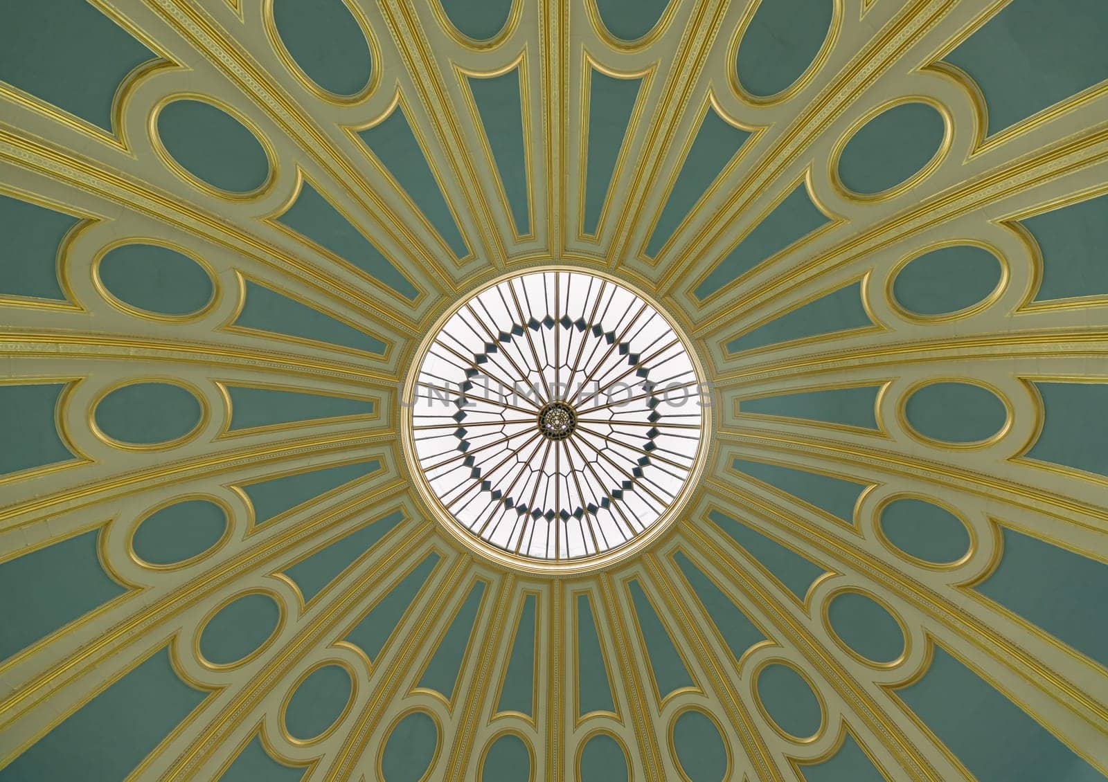 London, UK - May 31, 2025 - Looking up Domed ceiling of The British Museum Reading Room which is constructed using suspended from cast iron struts that hang from the frame and the ceiling is made from papier-mache interior of the dome repaired and the original blue, cream and gold colour scheme reinstated (inspired by the roof of the Pantheon in Rome), use it as your Wallpaper, Poster and Space for text, Selective focus.