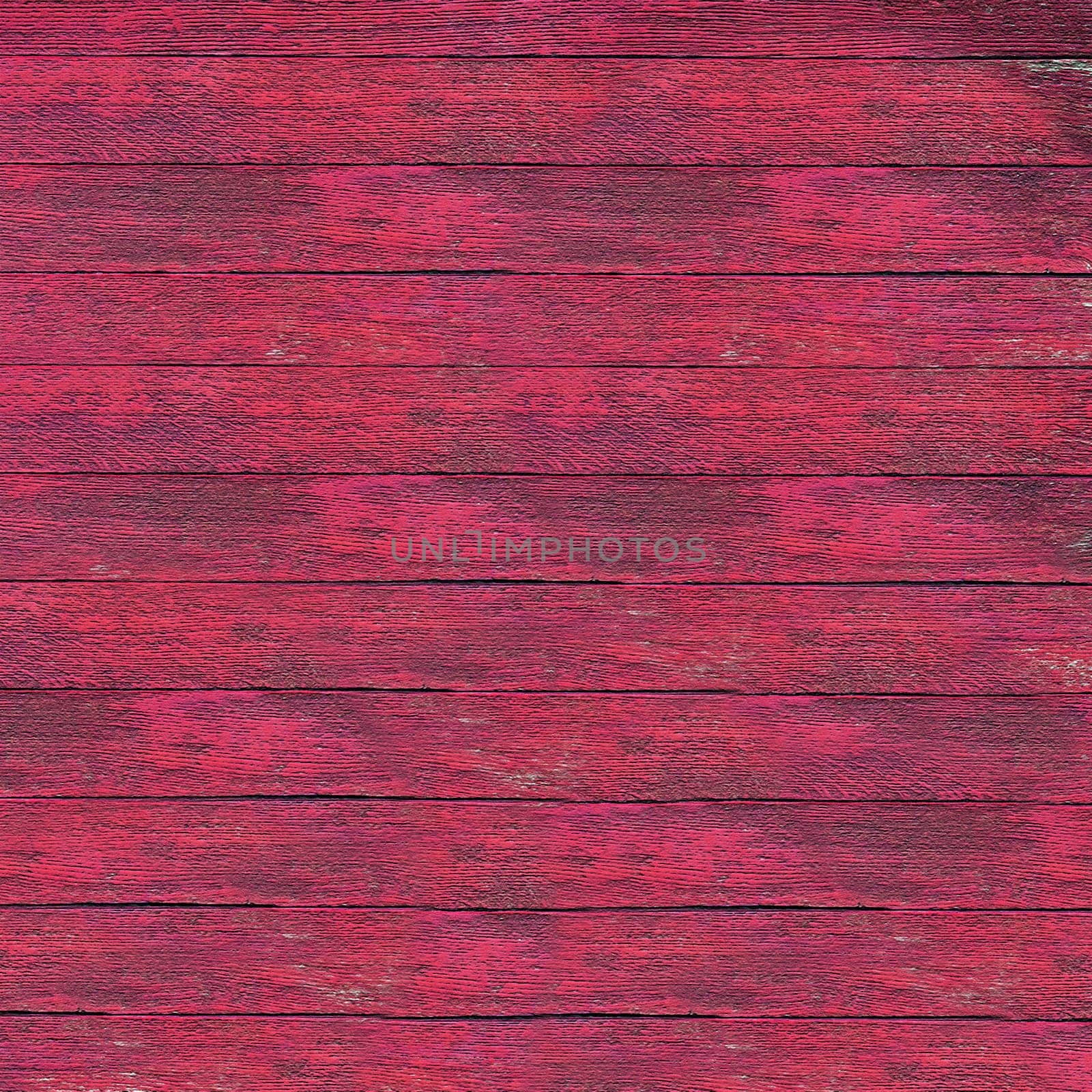 Pink painted wooden boards creating a weathered, rustic background texture, ideal for design projects needing a vintage or aged feel