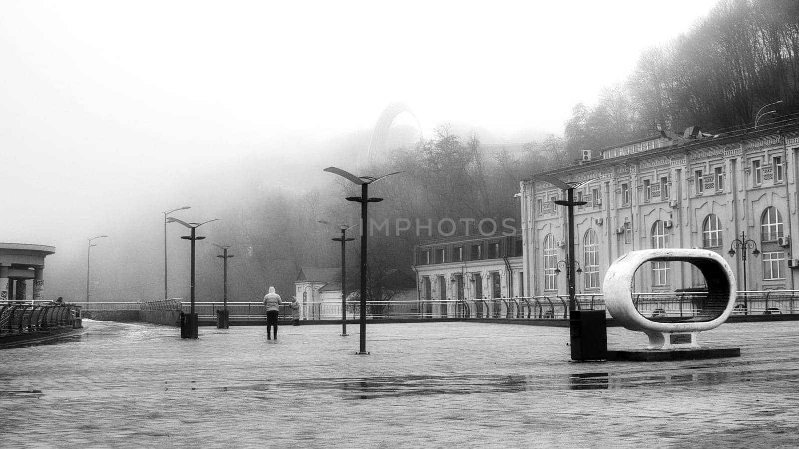 Encased in a dense layer of mist, the waterfront becomes a mysterious and captivating domain. High quality photo