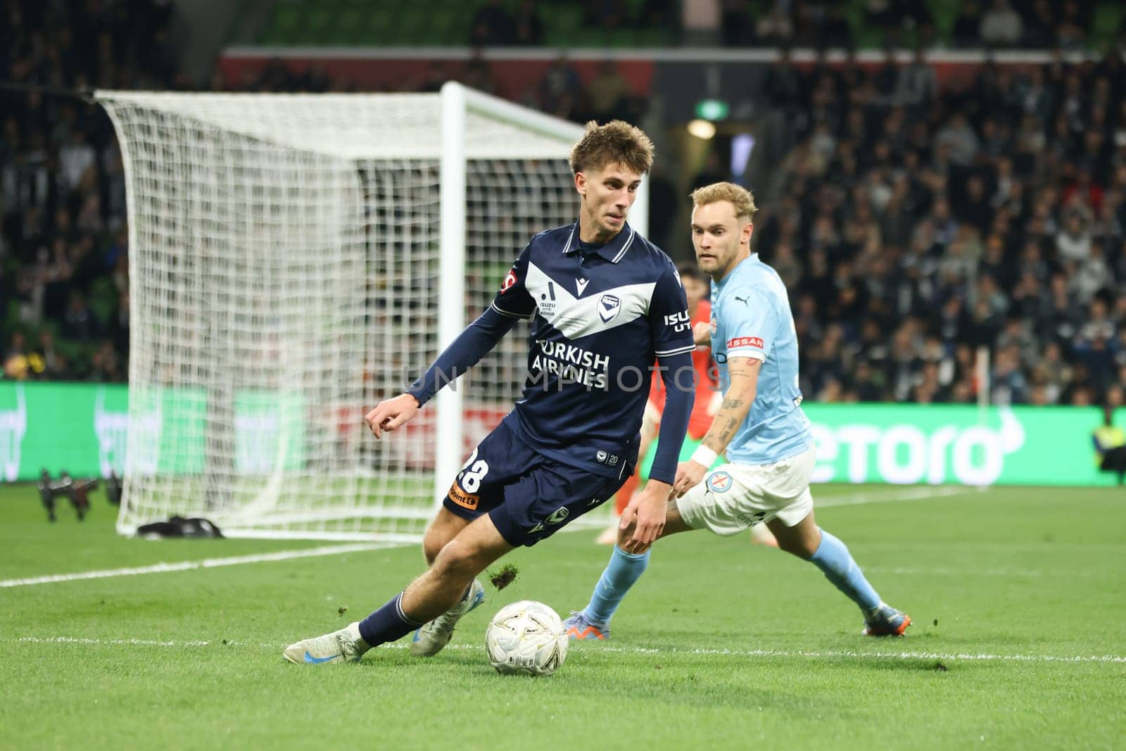 MELBOURNE, AUSTRALIA - MAY 31: Kasey Bos of Melbourne Victory competes for the ball with Nathaniel Caleb Atkinson of Melbourne City in the A-League Men Grand Final match at AAMI Park on May 31, 2025, in Melbourne, Australia.