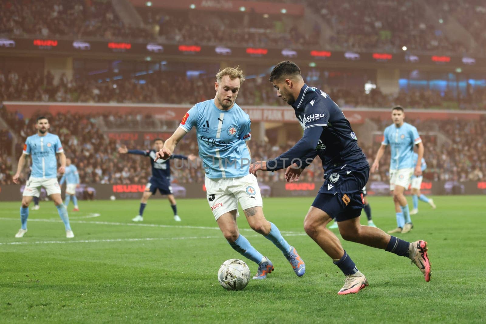 MELBOURNE, AUSTRALIA - MAY 31: Nathaniel Atkinson of Melbourne City battles with Zinedine Machach of Melbourne Victory during the A-League Men Grand Final match between Melbourne City and Melbourne Victory at AAMI Park on May 31, 2025, in Melbourne, Australia.