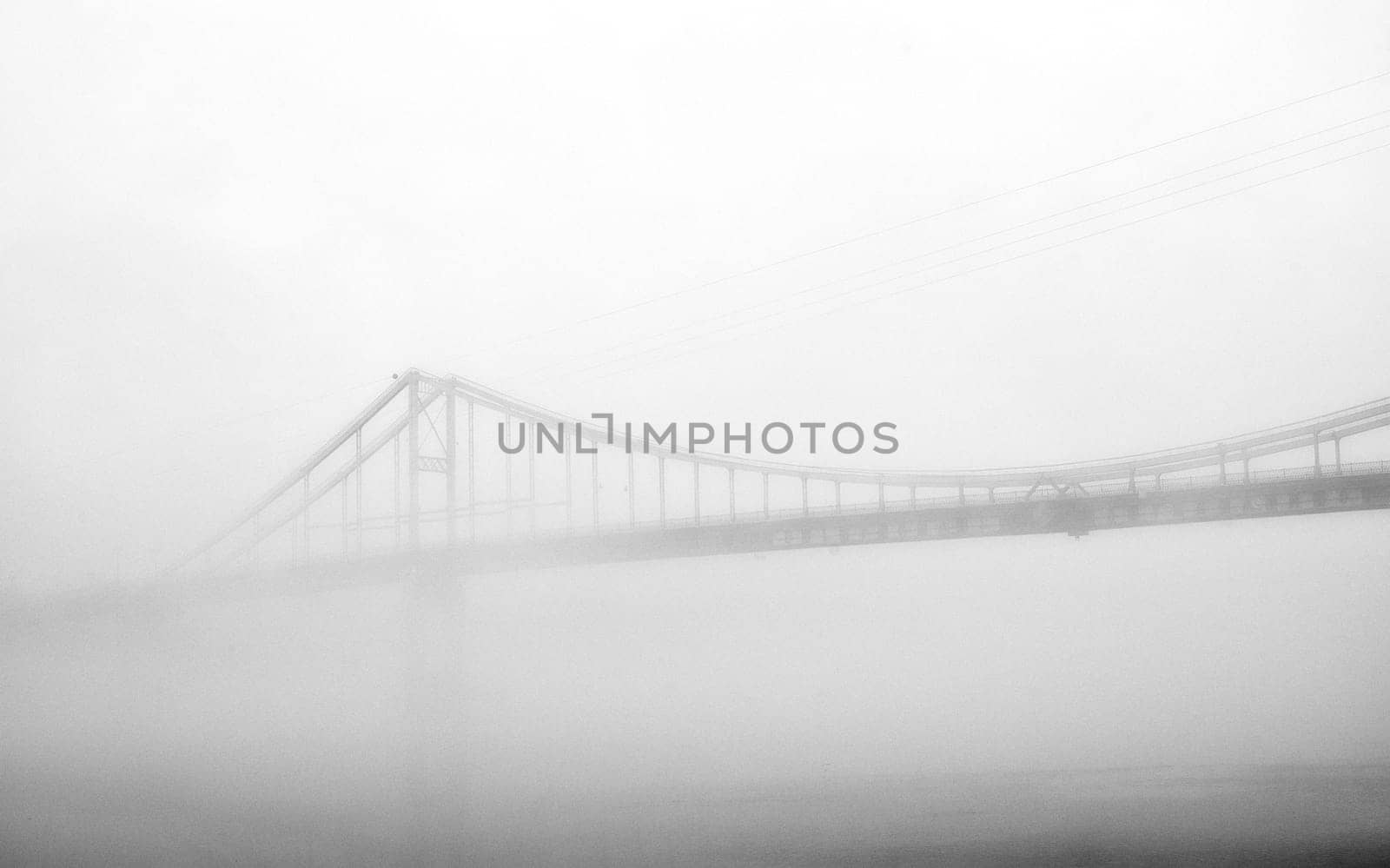 In the embrace of the ethereal mist, a bridge stands as a gateway to the unknown, connecting the shores of reality with the veiled realms of mystery.