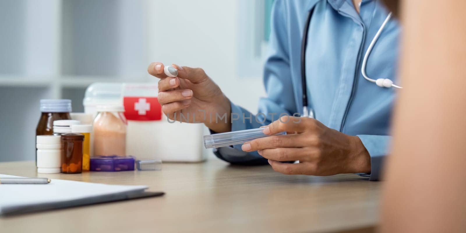 A healthcare provider prepares a medication dose, showcasing professionalism and attention to patient safety in a clinical setting.