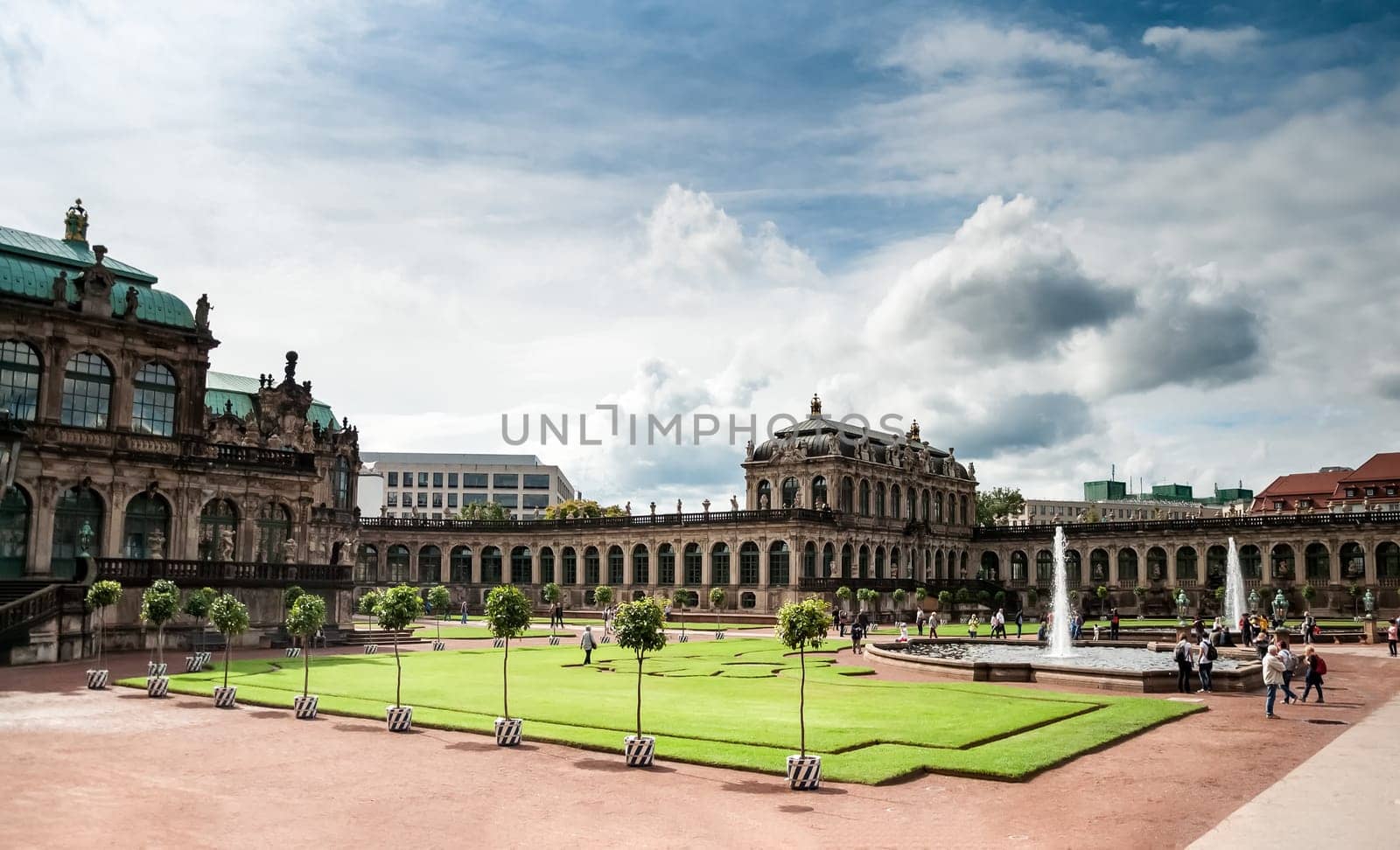 View of Zwinger square from steps of Old Masters Picture Gallery, Dresden, Saxony, Germany. Great clouds in blue sky, famous picture gallery with world-scale masterpieces, heavily ruined in WWII and then restored.