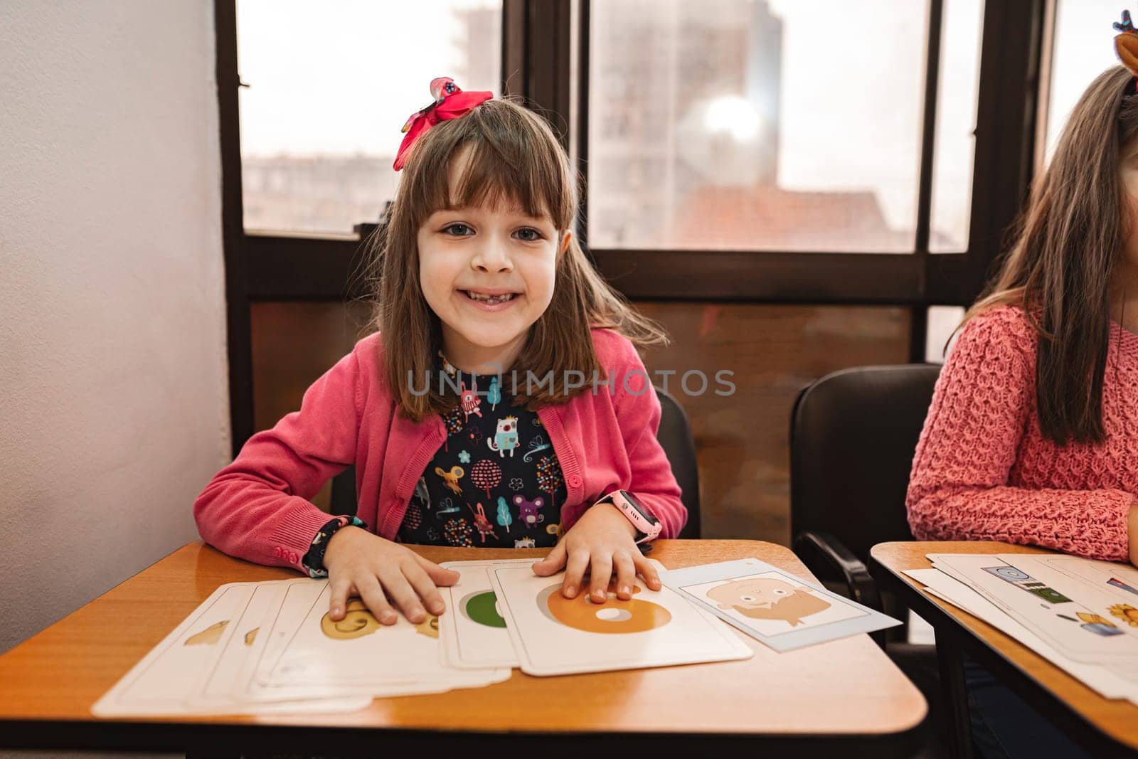 Female elementary students together at language school.