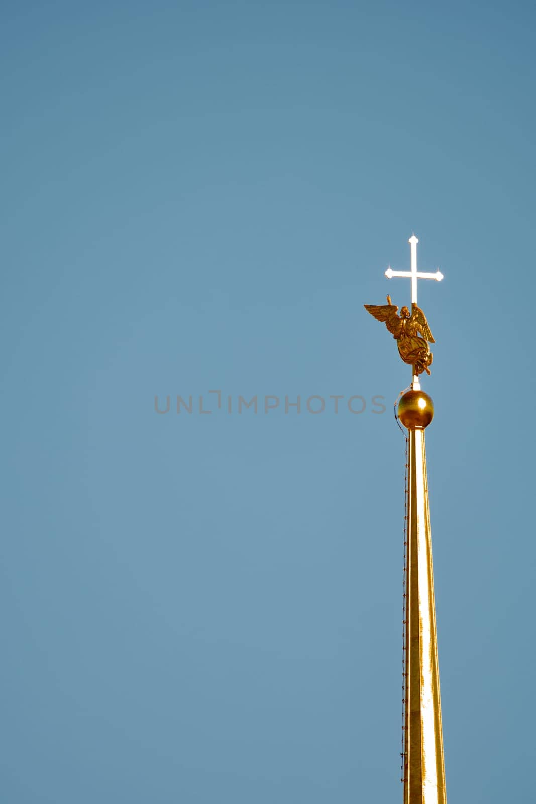 the Peter and Paul Fortress spire at sunset. High quality photo