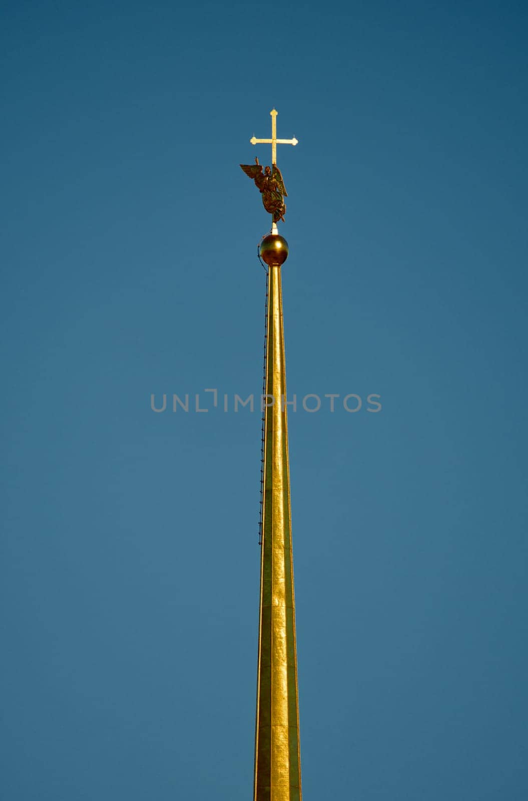 the Peter and Paul Fortress spire at sunset. High quality photo