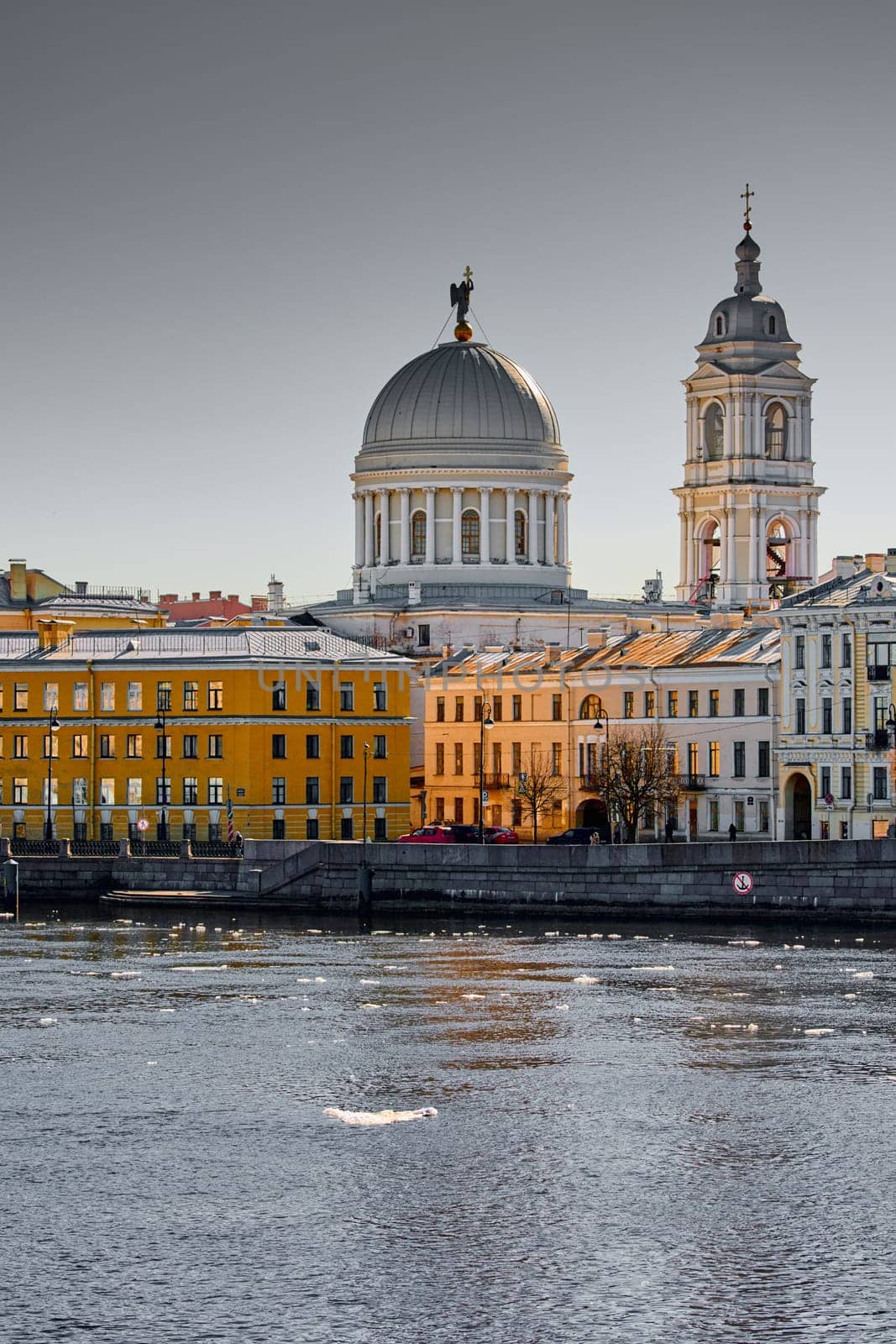 Russia, St.Petersburg, 27 March 2025: Church of St. Catherine the Great Martyr on a sunny spring day, Makarov Embankment, ice drift on the Neva River. High quality photo