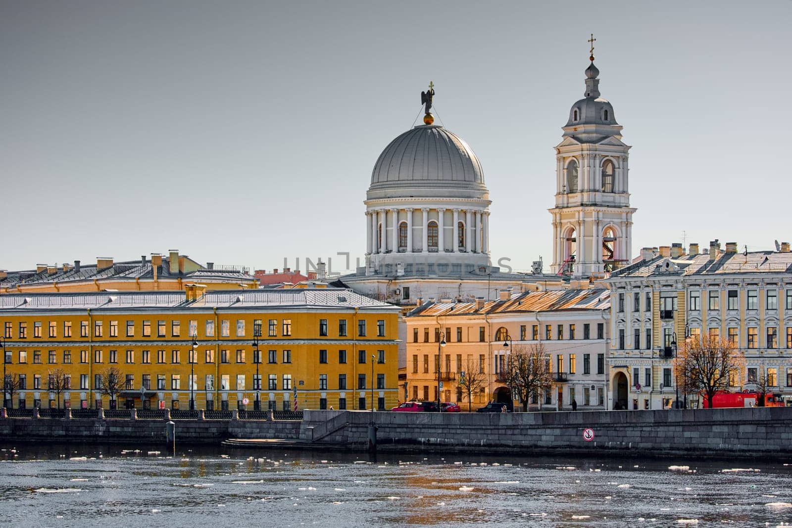Russia, St.Petersburg, 27 March 2025: Church of St. Catherine the Great Martyr on a sunny spring day, Makarov Embankment, ice drift on the Neva River. High quality photo