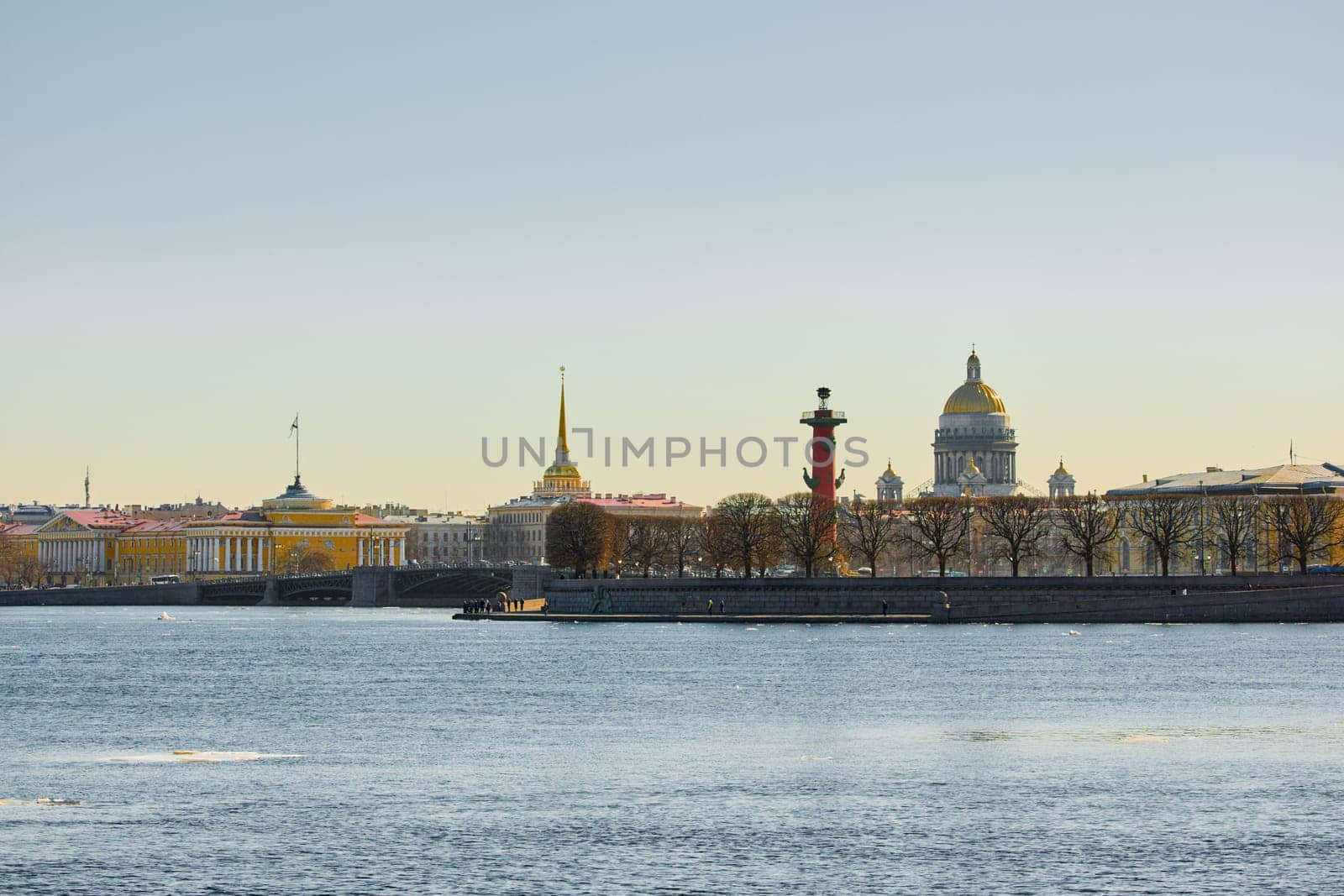 ice drift on the Neva River with a view of the arrow of Vasilyevsky Island with rostral columns, the Winter Palace, St. Isaac's Cathedral, the Savior on Spilled Blood. High quality photo