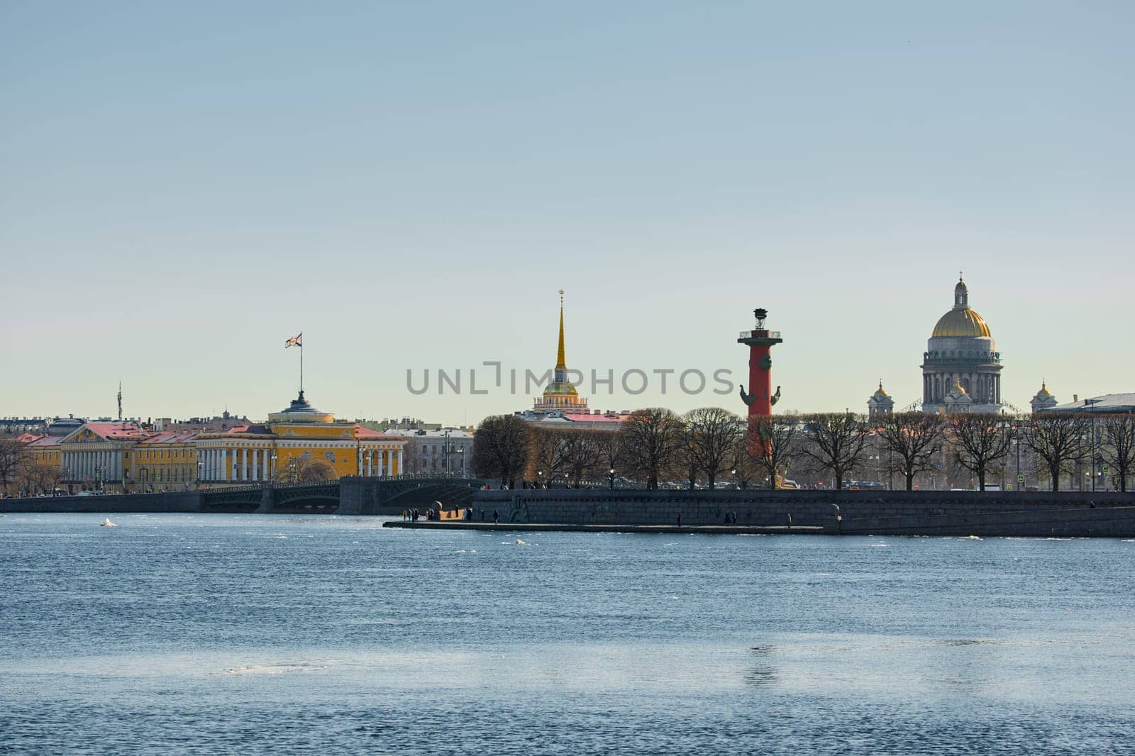 ice drift on the Neva River with a view of the arrow of Vasilyevsky Island with rostral columns, the Winter Palace, St. Isaac's Cathedral, the Savior on Spilled Blood. High quality photo
