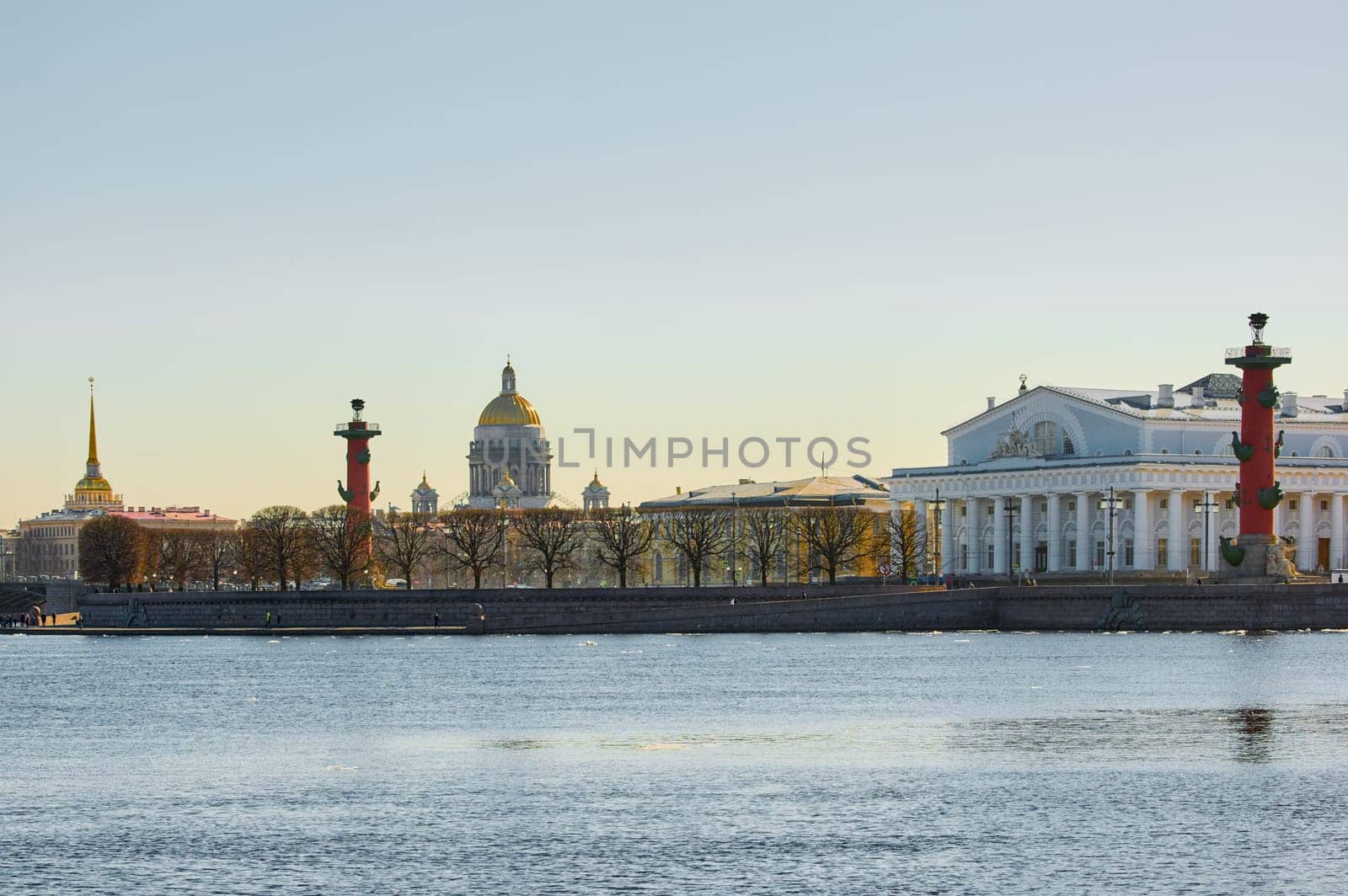 ice drift on the Neva River with a view of the arrow of Vasilyevsky Island with rostral columns, the Winter Palace, St. Isaac's Cathedral, the Savior on Spilled Blood. High quality photo
