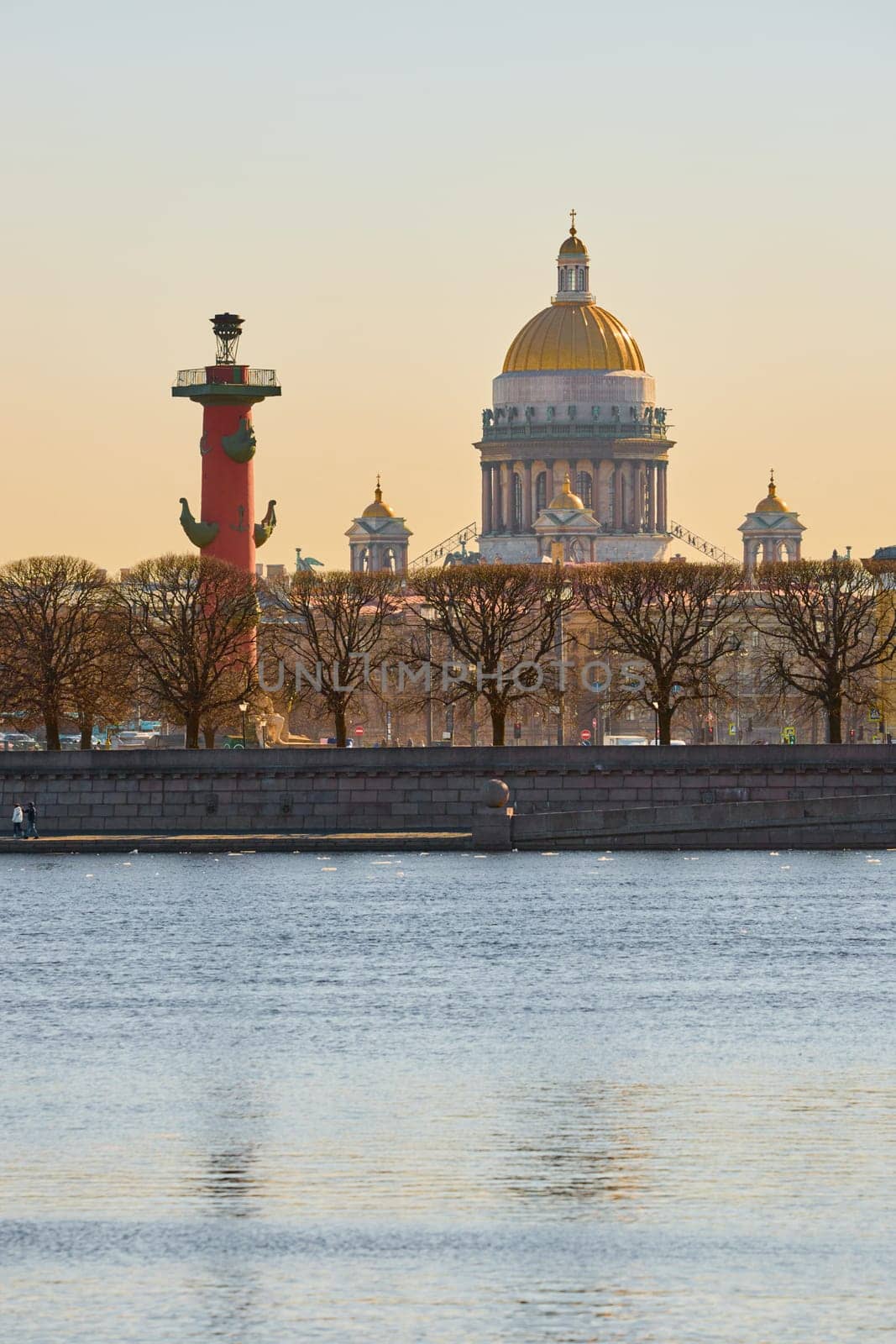 ice drift on the Neva River with a view of the arrow of Vasilyevsky Island with rostral columns, the Winter Palace, St. Isaac's Cathedral, the Savior on Spilled Blood. High quality photo